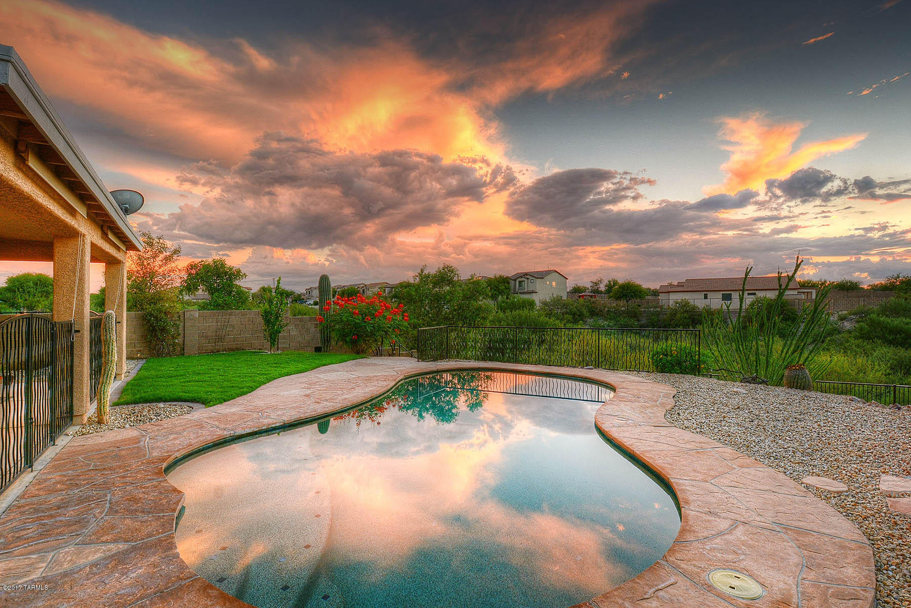 Hard to find 4BR-3.5BA +Loft-3 car garage home in Vail with a POOL under 300K!!  MOVE IN READY, TOO! Freshly painted inside, recently painted outside.  FABULOUS lot has desert & mountain vistas. Backs to a wash/ common area for privacy. Long concrete driveway from the street. Beautiful pebble tech pool is separately fenced from
the covered porch and side yards.  Flagstone deck and fire pit area is perfect for entertaining!
All tile floors on the first level.  Great room opens to the  eat in kitchen.  Tons of counter, cabinet space in the kitchen+ a built in desk.  Gas range! Pantry.
Formal dining room.  Upstairs has 3 bedrooms, loft & 2 baths + spacious master bedroom with huge closet
double vanities- garden tub & shower. Solar water heater. Dual zone HVAC, Alarm. THIS HOME HAS IT ALL!