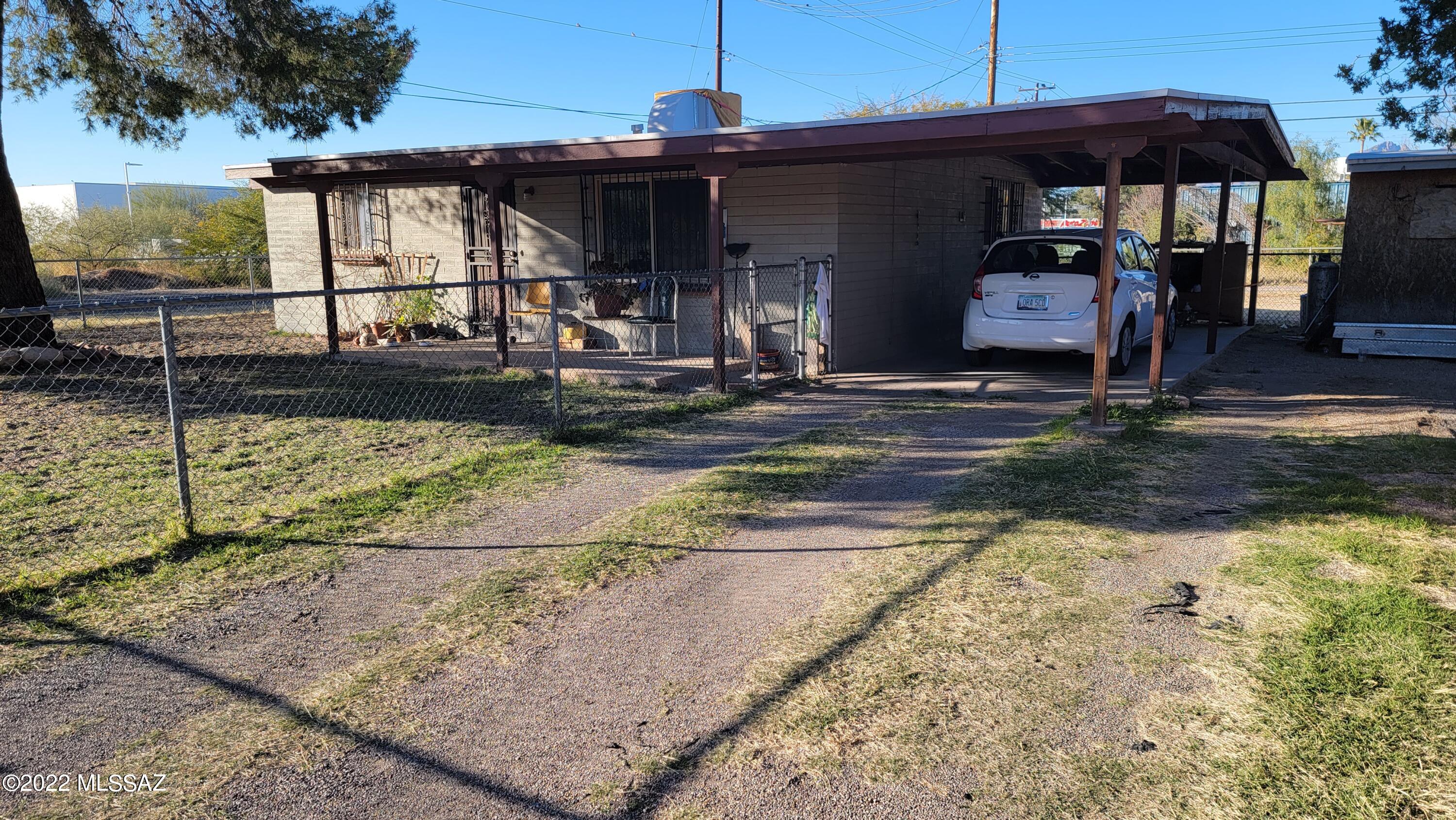 Estate Sale!  Long time rental on nice lot.  Two Bedroom, one Bath.  Tile floors thru-out.  Single carport and off street parking.  North/South orientation.