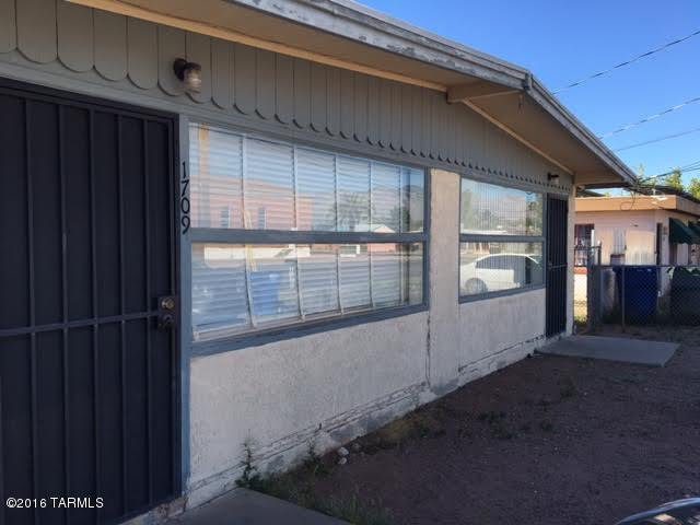 Terrific location! Close to downtown and the U of A. Easy to rent with rare vacancies. One unit recently painted and has new flooring. Bath updated also! It is being left empty to allow for easy showings. Both units are the same floor plan with wood beamed ceilings. Quaint and clean!  Individually metered. Won't last long at this price!