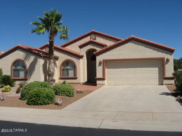 Exceptional property located in premier gated Green Valley Subdivision! Home features tile roofing, office/den, vaulted ceilings, arch ways, upgraded 16'' x 16'' tile, additional storage space, reverse osmosis water system, wood shutters, patio access off of master bedroom, master bathroom tub & walk in shower, and built in barbecue! Enjoy remarkable mountain views from the  professionally installed brick patio complete with full irrigation system!  Pride of ownership at its finest!
