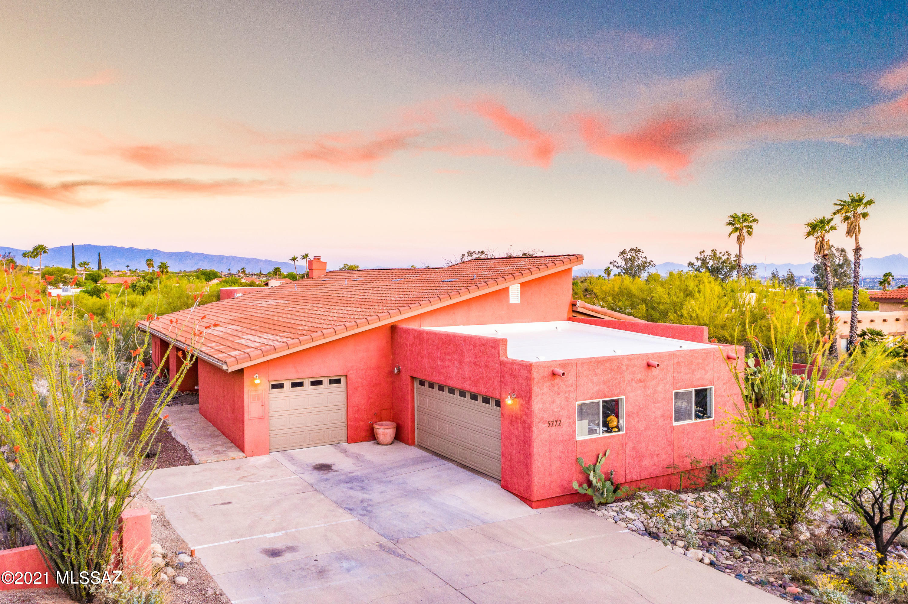 Located in the heart of the Catalina Foothills, 2,895 Sq Ft, 3 Bedroom, 2 Bathroom home with gorgeous mountain views, privacy, updated kitchen and entertainer's backyard. Vaulted ceiling in the Living room, wood burning fireplace, and an abundance of natural light. Bamboo wood flooring in the main living areas. Kitchen is equipped with two ovens, newer induction cooktop, breakfast bar, and wet bar. Formal Dining room just off the kitchen. The Master Bedroom is expansive with fireplace, updated large elfa custom walk-in closet , and doors leading to the backyard. Huge Master Bathroom with double vanity and separate shower. Laundry room with additional storage, two car garage and separate one car garage located by the kitchen. Enjoy outdoor living under the covered patio, sparkling pool, hot tub and wood burning, bee hive fireplace. Fence around pool can be removed. Numerous upgrades including Nest thermostats & smoke/carbon monoxide detectors, Kinetico water softener and R/O system, fresh exterior paint, and new shade sail in backyard.