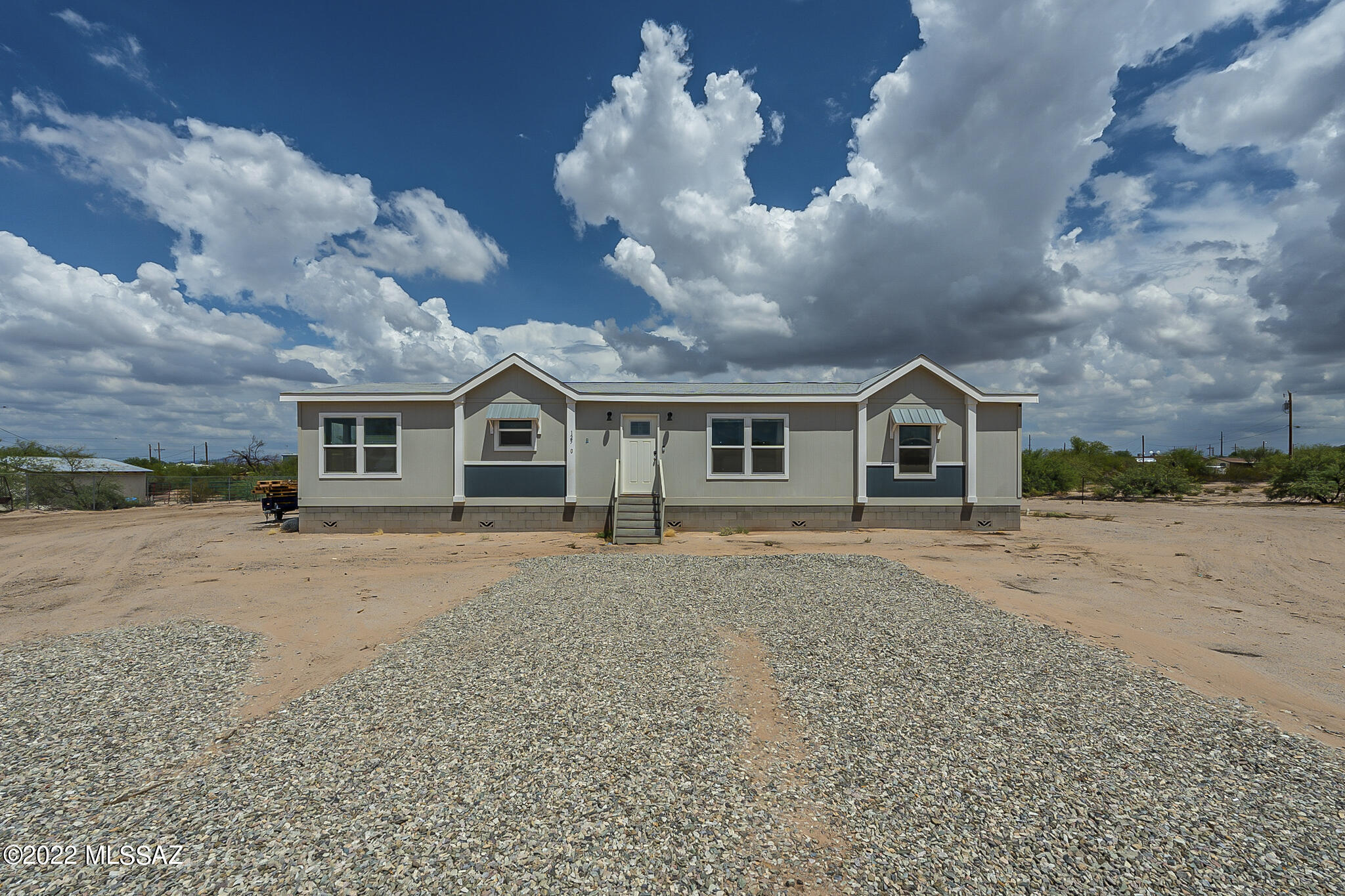 (This home has an assumable FHA loan at 3.75 % for qualified buyers)
This Beautiful almost Brand New home is on Over an Acre with paved roads. Are you wanting an open concept so you don't miss out on anything while you're cooking and hosting? Then this is the home for you! It also features a coffee/cocktail bar area with a mini fridge perfect for entertaining and a split bedroom floor plan.  The yard has already been cleared of the natural desert brush and definitely big enough for you to create your own personal desert paradise.