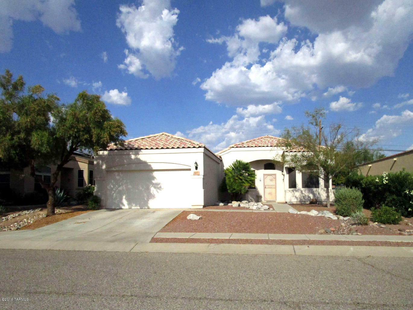 Available for Move-In September 1st. Contemporary Floor Plan with 3 Bedrooms, Den and 2 Baths Located in Rita Ranch and the Award Winning Vail School District. Large Open Great Room with Dining Area. Kitchen has lots of Cabinets, Counter Space, Breakfast Area, 2 Pantries and Breakfast Bar. Large Master Suite with Sitting Area and Door leading to the Covered Rear Patio. Master Bath has Dual Sink Vanity, Soaking Tub and Separate Shower. New Ceramic Tile Throughout with Carpet in Bedrooms. Den with Double French Doors and Built-in Shelving. All Appliances including Washer and Dryer. Nice Covered Patio and Backyard Shade Tree, Faux Turf and Mountain Views! Good Credit required.