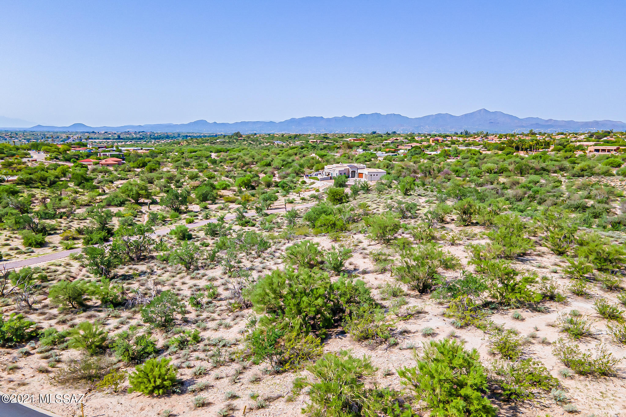 Fantastic 2.1 acre lot in beautiful Oro Valley. Perfect for custom build with great city and mountain view capability. Pick your builder and create a dream home! Great access to shopping, dining and more.