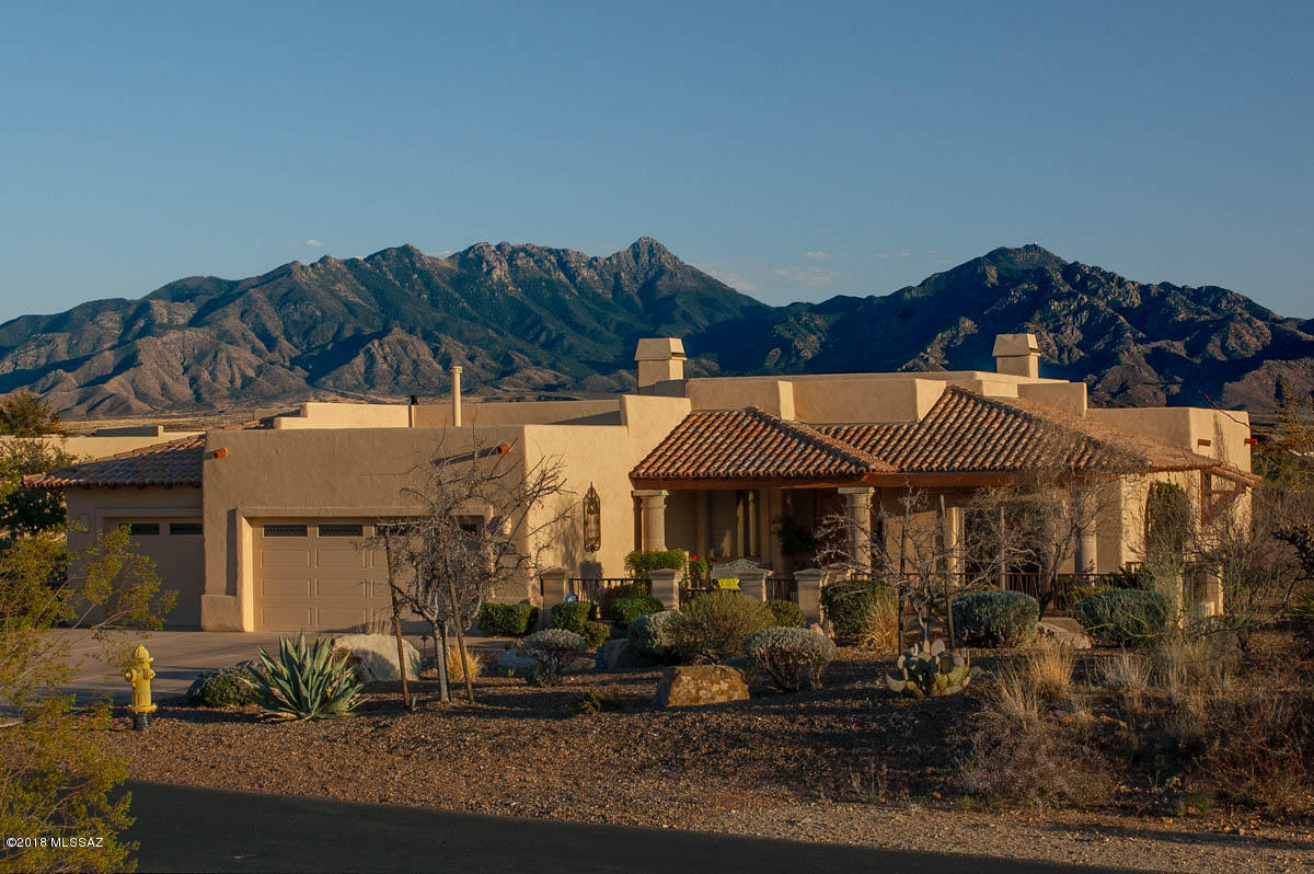 Panoramic Views!!! This Stunning Expanded Durango floor plan awaits your most discerning buyers. Beautifully Appointed with Anderson Windows, Cantera Columns, Granite Counter tops, tile, 2 FP, Gourmet Kitchen, Expansive Windows to allow the Commanding Views, Open Great Room Excellent for Entertaining and so much more!! The mature landscaping and intimate patios allows you to enjoy the fabulous sunrise and sunsets only found in the desert!! Welcome Home...