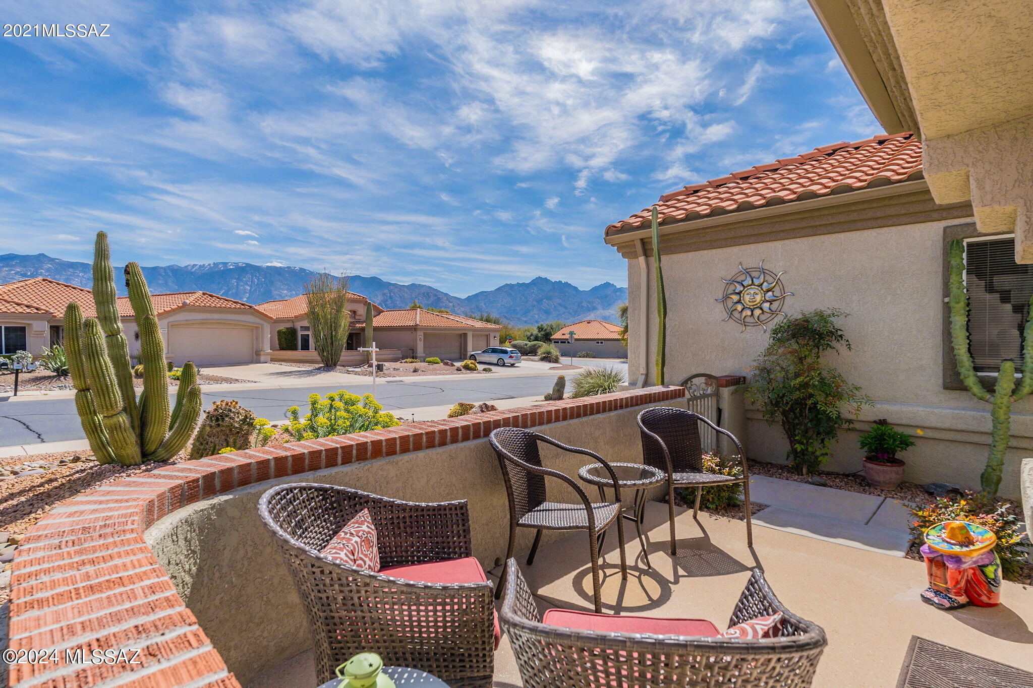 This well cared for expanded Mariposa model has an additional 100sq ft. Front courtyard takes advantage of the Catalina mountain views. This home features a bright open floor plan with updated tile flooring(2020), kitchen features updated quartz counters & breakfast bar. The spacious primary bathroom includes dual sink granite counters with updated shower. Enjoy the beautiful professional landscaped front and backyard, with added pergola. Extended garage with utility sink and cabinets.
Updates include roof underlayment and HVAC in 2019.