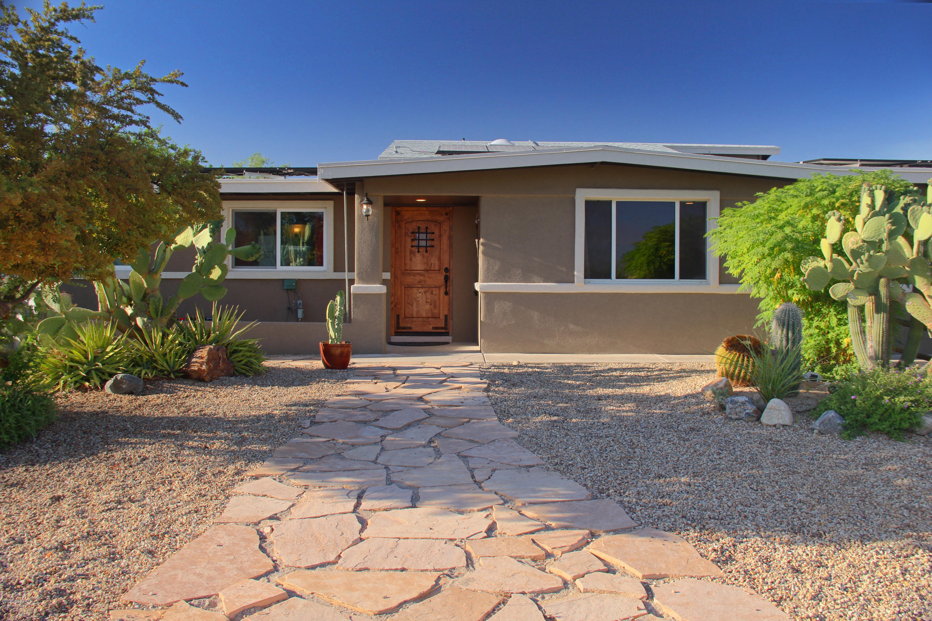 Your new home sits on a hilltop overlooking Oro Valley and boasts fantastic views of the Tortolita & Catalina Mountains. Private cul-de-sac lot that is fully landscaped. Kitchen has custom Pecan cabinets, granite counters, professional appliances (Viking/GE/Fisher-Paykel). Permitted family room addition has high ceilings, dramatic views and a beehive fireplace.  Permitted conversion of 2 car garage includes 2 bedrooms, large laundry/storage area. All windows replaced, bathrooms remodeled, knotty alder doors, solar panels. Space to entertain: vista view deck, pool area including built in BBQ stainless grill (5 burner), pizza oven with space for kamado smoker.  Horse facilities are possible, RV parking with water/dump station, 30 & 50 amp service, 3 out buildings and one is a very large workshop or facility for horses or tack, 10'x45' bocce court, plenty of parking.  

Come to your new home today!