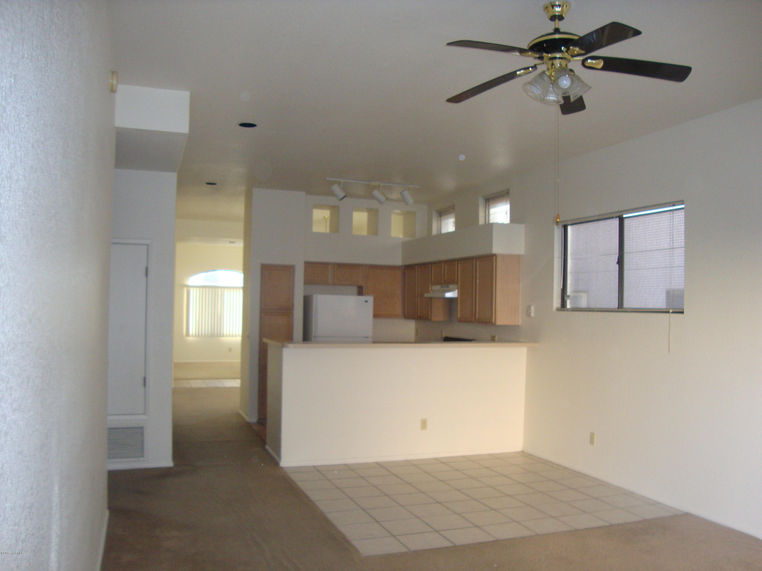 Vail School District! This home has formal living and dining rooms and a family room off the kitchen, ceiling fans in all of the bedrooms, all appliances including washer and dryer, covered patio, 2 car garage, laundry room and A/C. Pets Negotiable.