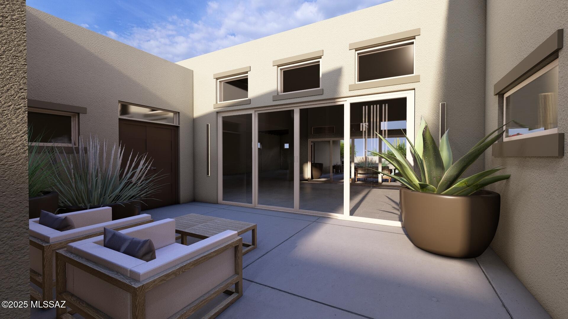 Experience luxury living in the heart of Rancho Sahuarita's premier gated community—Haciendas Del Lago. ''To-Be-Built'' New Construction Home, this custom modern home offers the perfect blend of elegance, comfort, and high-end design. Boasting 3 spacious bedrooms, 3.5 bathrooms, and a versatile bonus room, this stunning residence is designed with today's lifestyle in mind.

From the moment you enter inside, you'll be captivated by soaring 15-foot ceilings that create an airy, open ambiance throughout the home. The gourmet kitchen is a dream for culinary enthusiasts, featuring expansive granite countertops and sleek modern finishes that elevate the entire space.

Unwind in the primary suite, where a spa-style retreat awaits. The luxurious bathroom includes a deep soaking tub, designer , and a serene atmosphere perfect for relaxation. Seamlessly blending indoor and outdoor living, expansive glass sliding walls open up to a spacious patioideal for entertaining or simply enjoying Arizona's beautiful weather.

Situated within a picturesque lakeside community, this home offers access to an array of resort-style amenities. Enjoy the renowned Rancho Sahuarita water park, a state-of-the-art fitness center, and scenic walking trails that bring the outdoors to life.

Don't miss your chance to own a slice of paradise in one of Southern Arizona's most sought-after communities. Schedule your private showing today and experience the unmatched luxury and vibrant lifestyle of Haciendas Del Lago. 

All artistic renderings, images, square footages, floor plans, features, and colors are for illustrative purposes only and are approximate. Actual square footages may vary due to construction. Upgraded landscaping, decorative items, suspended lighting, furniture, and enhanced interior paint may be shown but are not for sale, even for an additional fee. Photos should not be relied upon to confirm specific features. Items shown may include options not standard on all models or not included in the purchase price. Availability and neighborhood development plans are subject to change without notice.