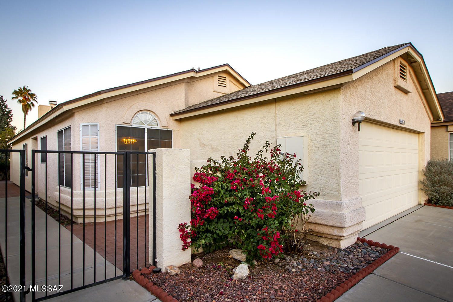 Beautiful, well-maintained home on cul-de-sac w/great open floor plan. Just painted interior w/3 bdrms & 2 baths. Spacious great room w/dining area, fireplace w/tile hearth & architectural features, ceiling fan, door to paving brick patio adjacent to open space. Eat-in kitchen w/pantry, refrigerator & glass top range; built-in tv, pull out shelf & Lazy Susan corner cabinet. Laundry room w/washer & dryer. Door off kitchen to 2 car garage w/freshly painted floor, custom cabinetry & shelving. Community pool, spa, & playground to enjoy.  Great location w/easy access to Pima Community College; Public, Charter & Private schools; YMCA, Churches, Hospitals, Public Library, Golf, River Park, movie theater,restaurants, shopping, Interstate 10 & more. This is a beautiful home in a great community!