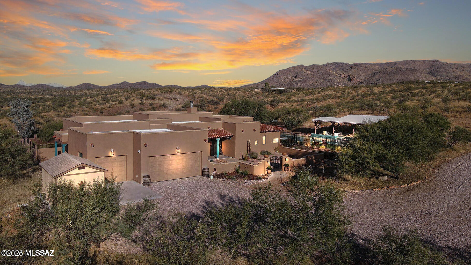 Stunning Custom Southwest Territorial Home on 30 Acres Bordering State Land. Experience the perfect blend of luxury, privacy, and wide-open space with this exceptional custom-built Southwest territorial home, set on 30 rolling acres and bordered by over 130,000 acres of pristine State Trust Land. Designed by renowned builder Scott Pottinger, this meticulously maintained residence offers 3 bedrooms, 3 bathrooms, and refined finishes throughout. The gourmet chef's kitchen is a culinary dream, featuring premium Dacor appliances, a gas cooktop, warming drawer, granite island with prep sink, and rich alder cabinetry. The open-concept layout flows seamlessly into the spacious great room, anchored by a custom slate-surround wood-burning fireplace and 12-foot exposed beam ceilings. FULLY FURNISHED The expansive master suite is a private retreat, complete with a six-foot soaking tub, slate walk-in shower, and a generous walk-in closet. All bedrooms open directly to a wraparound porch, inviting in the serene natural surroundings.
Outdoors, enjoy a sparkling 60-foot lap pool and spa, beautifully landscaped grounds with custom masonry walls, wrought iron accents, and breathtaking views in every direction. Additional features include Pella windows and doors, granite countertops throughout, a bright split floor plan, and an oversized 3-car garage designed to fit most trucks.
This unique horse-friendly property includes a private registered well, full RV hookup, and is located on a paved road. With potential for subdivision and proximity to hiking, horseback riding trails, restaurants, golf, shopping, and medical care, this one-of-a-kind home offers unmatched comfort and opportunity.
Truly a must-see property for those seeking luxury living in harmony with nature.
Furnishings are negotiable.