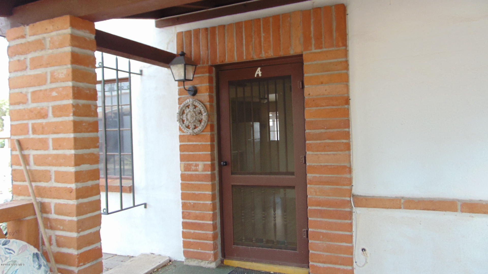 FULL SIZE RANGE, NEWER REFRIGERATOR, SHED, BATH HAS TILED SHOWER, WOOD LAMINATE FLOORS, PARTIALLY FURNISHED, SET BACK UNIT WITH PARKING SPACE ON LOBO
