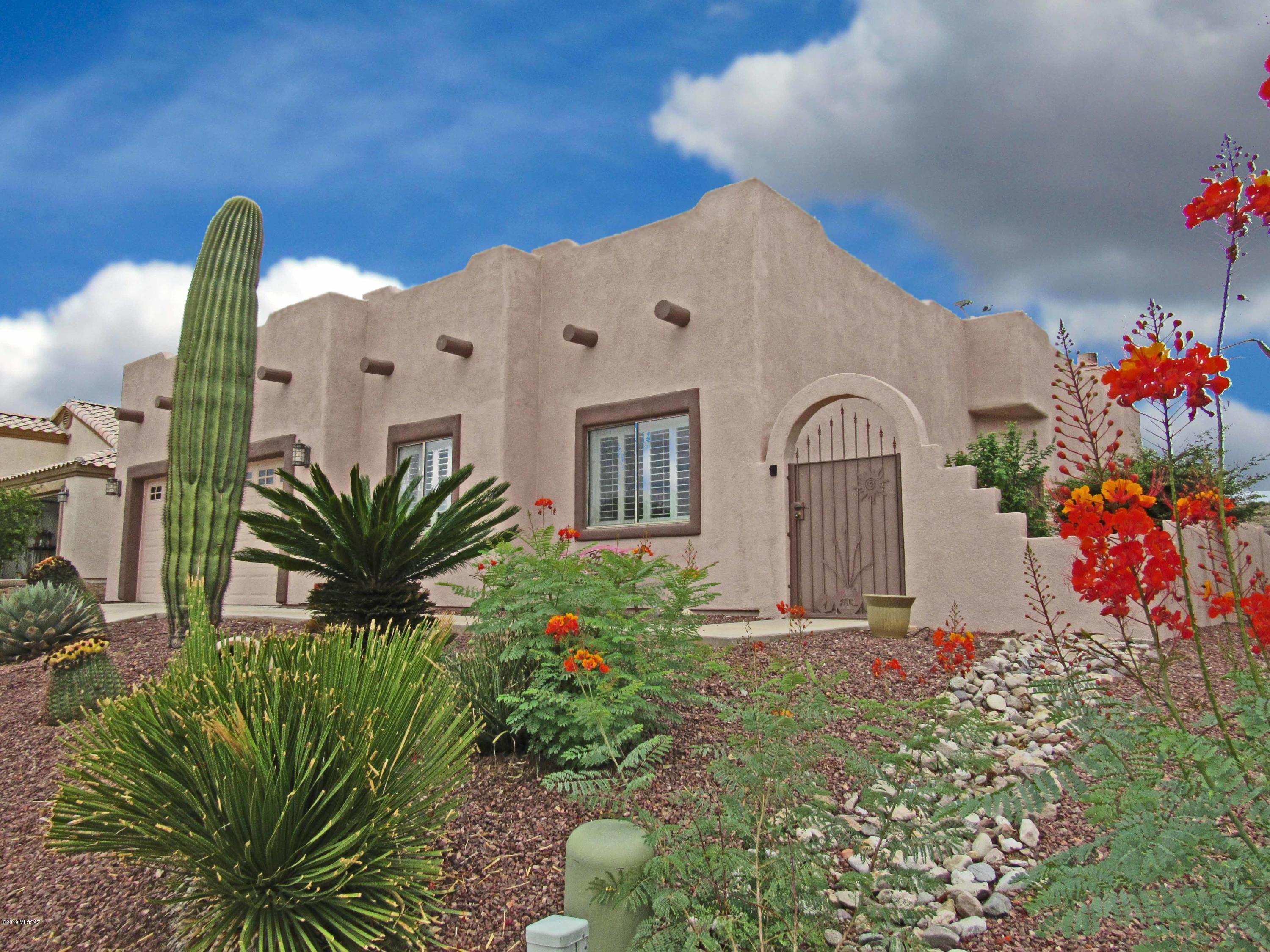 This three-bedroom, two-bath, home in Desert Creek features a very open floor plan.  It contains 1,660 square feet, granite counters, fireplace in the great room, screened porch, and a two-car garage.  The efficiently-arranged kitchen has newer appliances and both bathrooms contain executive-height vanities.  Best of all, there is a first-row seat to watch the ever-changing Santa Rita mountains from the front of the house!  And the large rear yard is very shaded and private—a perfect place to enjoy your morning coffee or evening cocktails.  

The property is conveniently located near the Duval Mine Road shopping corridor and I-19.  Make this your winter residence, or full-time home.
