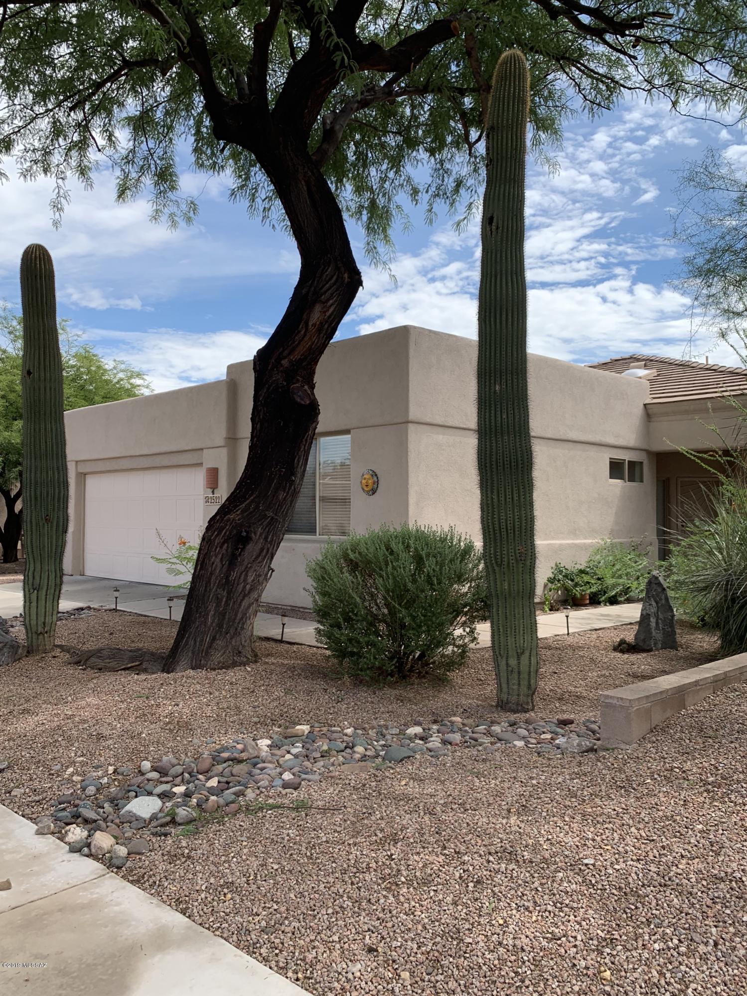 3 Bedroom Northeast gated community near Sabino Canyon and Tanque Verde. Built by AF STERLING. This home offers privacy on an oversized lot with view of the Catalina's and Rincon Mountains. Catalina and Rincon Mountain view! Ceramic tiled floors throughout except for bedrooms. Granite kitchen counters, plenty of cabinet space and breakfast bar. Backyard offers bricked in patios and covered patio, privacy and views, easy care! Great open floor plan. Amazing HOA has 3 community pools and spas, front yard maintenance and more! Close to shopping and park!