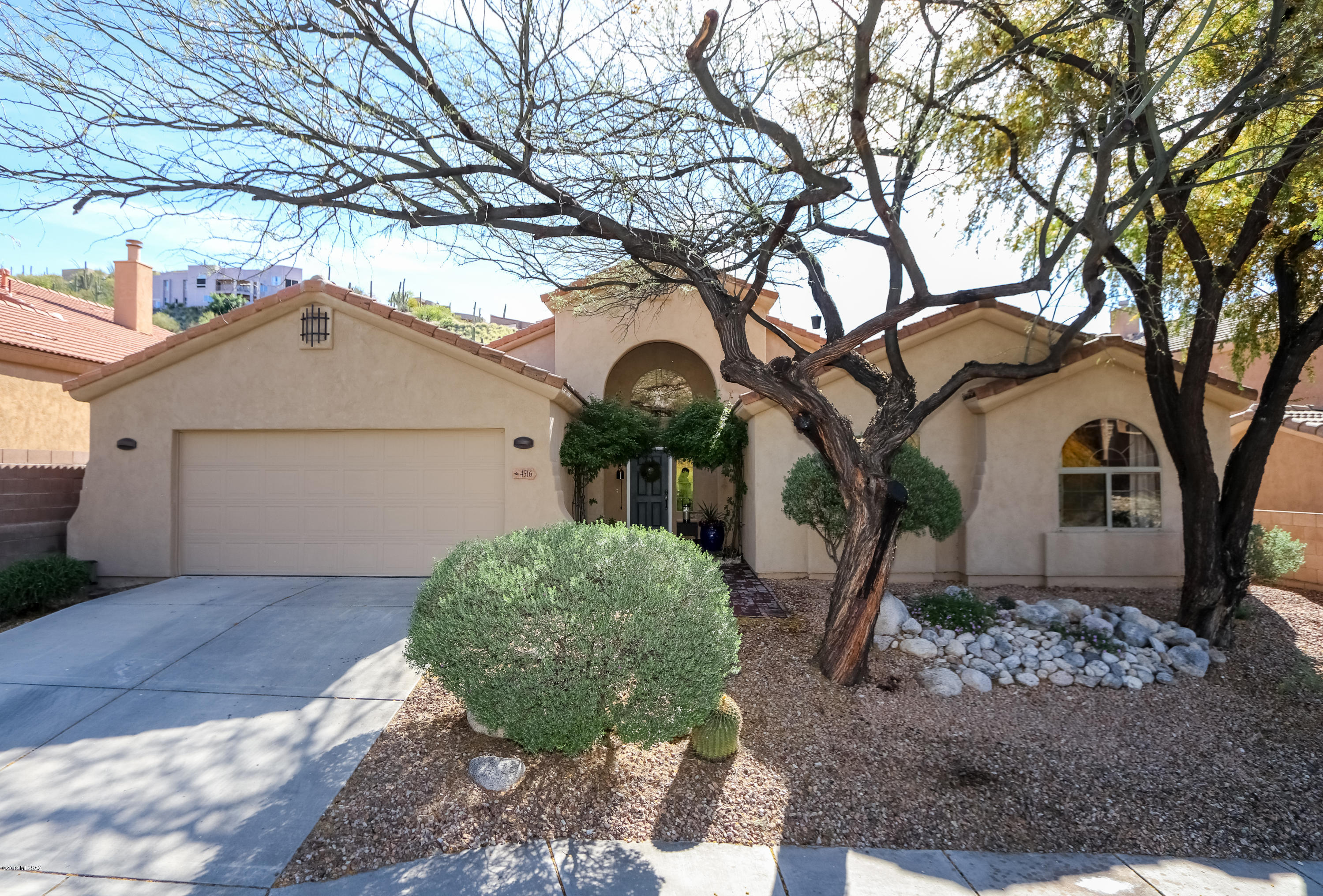 Nestled in the foothills of the Catalina Mountains, this 4 bedroom, 2 bath feels like a new model home. It is in the highly sought after, gated Sabino Mountain Community. Home features high vaulted ceilings, great sight lines & picture windows. The gourmet kitchen boasts high-end appliances, large island, granite counter tops & breakfast nook. Lovely living room with a cozy fireplace and a great room for formal dining and entertaining. Spacious master suite features large master bath w/double sink & large walk-in closet. One bedroom has amazing built-ins perfect for a home office. Stunning mountain views, wildlife, and water feature. Plus community pool, clubhouse, miles of great walking, close to Sabino Canyon, schools, shopping, dining. THIS IS A MUST SEE! More info in attached docs.