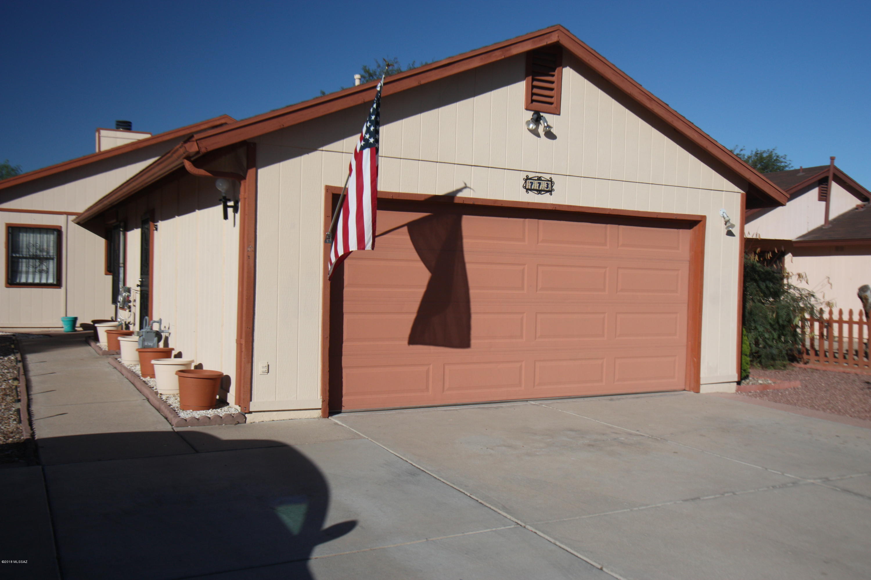 Well maintained 3 bedroom 2 bath home.  Fireplace and vaulted ceilings in the living room, neutral tile throughout home.  Master bedroom has vaulted ceiling, ceiling fan, dual sink in master bathroom, recirculating hot water as well as a large walk-in closet.  Ceiling fans in every bedroom. Brand new Whirlpool dishwasher and 1 year old Maytag washer and dryer included. Reverse osmosis in kitchen and water softener.  Lots of storage in 2-car garage as well as the outside sheds. Recently painted interior and exterior.