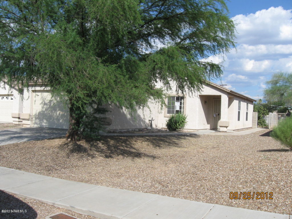 Nice property with fenced yard - 3 bedrooms, 2 baths, close to Davis Monthan Air Base, shopping and services. Covered patio, 2 car garage, laundry room, nice open floor plan. Call for requirements and application process.