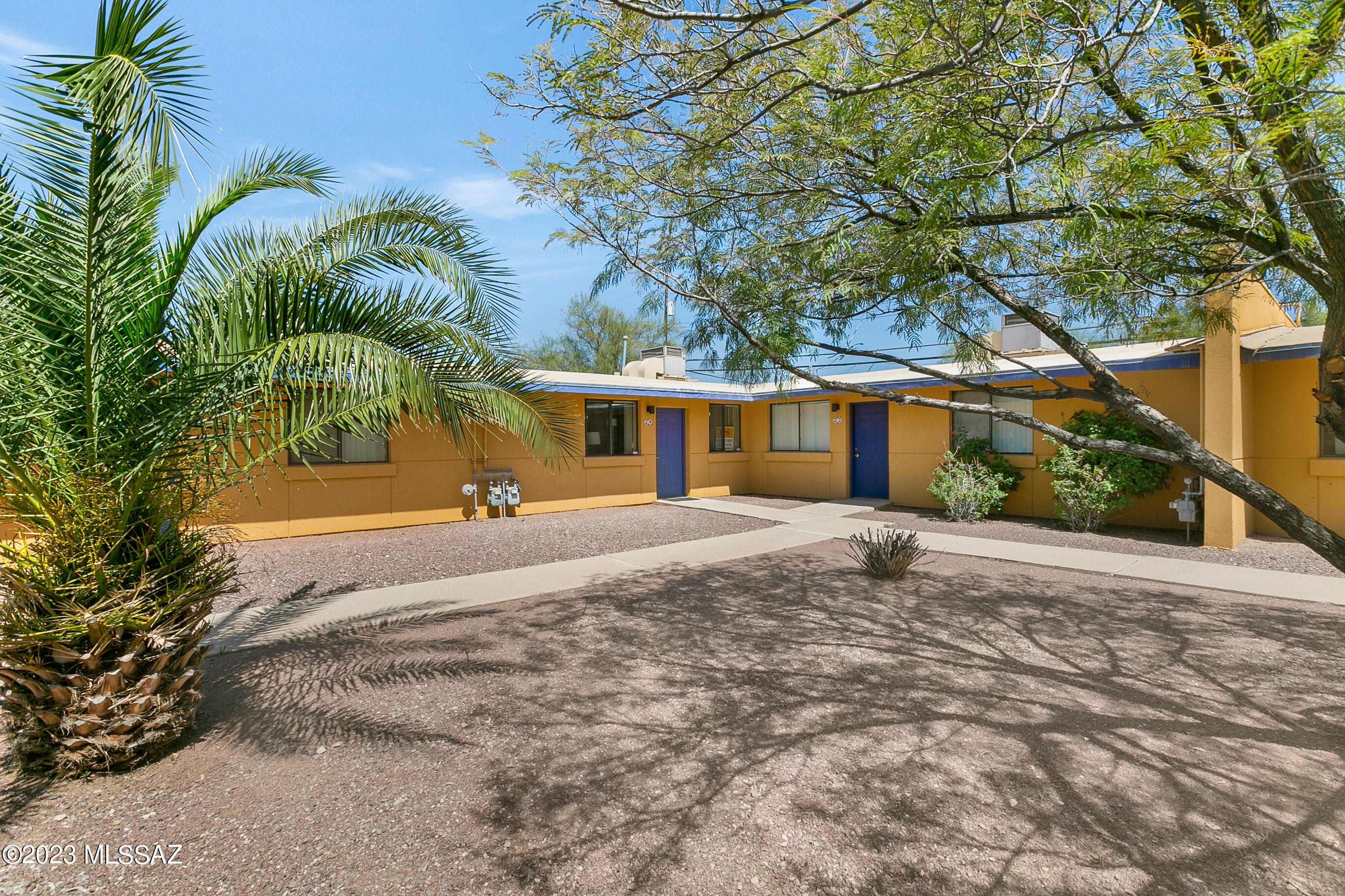 This amazing opportunity to enjoy Tucson living in a gated community is minutes from downtown, UArizona, Sentinel Peak & St. Mary's Hosp. Nicely updated with tile thru-out. All appliances remain including fridge & full size washer & dryer in spacious laundry room (avail in very few Sunset Foothills Condos). Enjoy the private patio off the enormous primary bedroom with en suite bath & generous walk-in closet. The second bedroom is adjacent to the hall bath & well suited for guests, family members or a home office with a window looking to the lush courtyard. Bright kitchen opens to second patio for al fresco dining. Community amenities include a Mid-Century modern clubhouse, pool & spa, playground for kiddos, basketball court & picnic area.