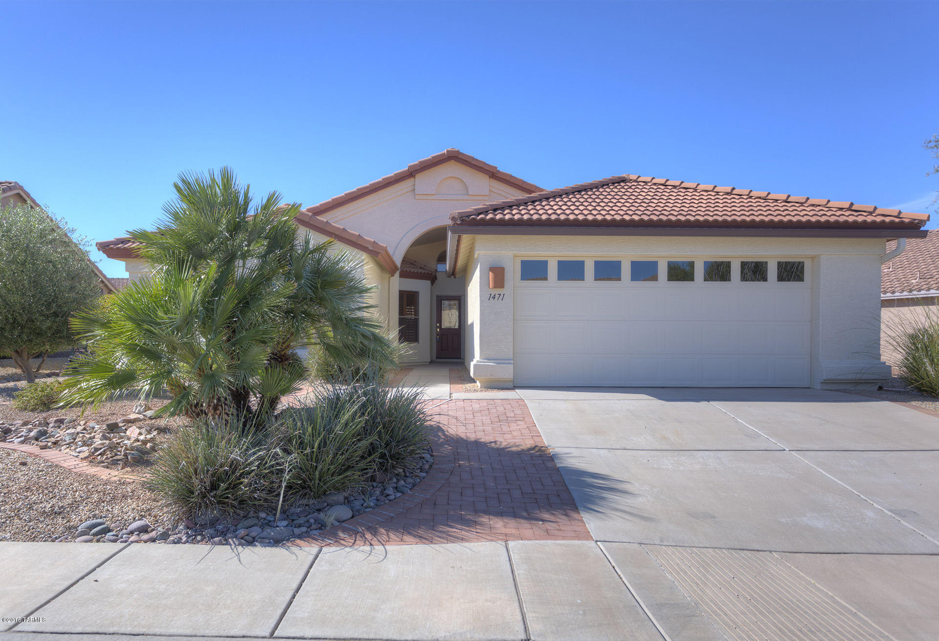 NEW LOW PRICE!! Seller motivated! This freshly painted home boasts high ceilings in the kitchen and living room, new laminate wood floors in the living room and den, and new carpet in the bedrooms. Ceramic tile in kitchen, entry and hallways. Clerestory windows in the living room and master bedroom make this home nice and bright.  Low maintenance landscaping in front and back yards, and back yard is fenced in.  Covered patio with brick pavers and solar screens on west-facing windows. Great Value!