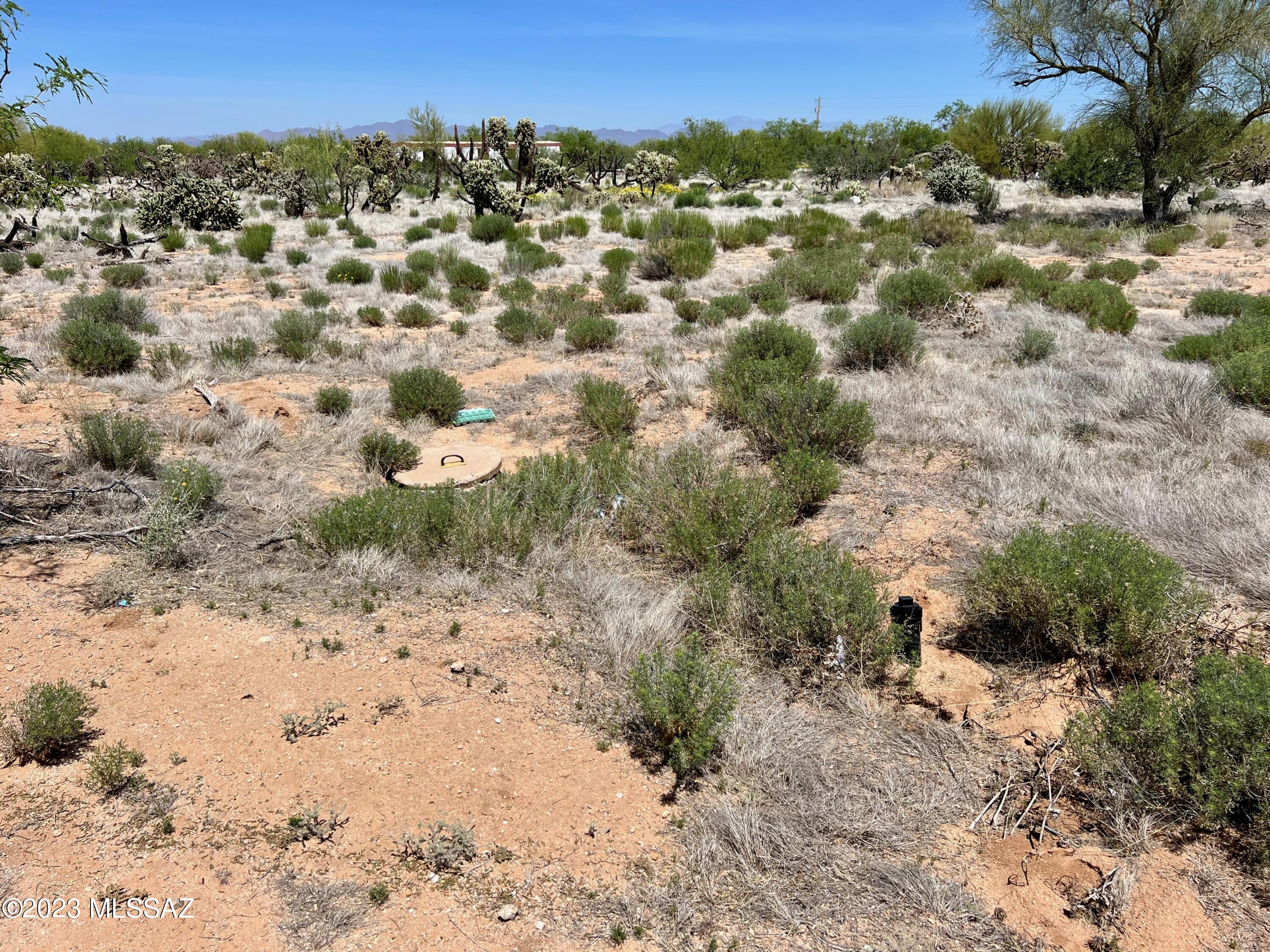 .984 acres of land that has a SEPTIC ALREADY INSTALLED and ready for use! You will need to bring the water and electric on to the lot but it's not far away. MANUFACTURED homes allowed!!! NO HOA! Live like you have always wanted to with no one around to tell you what to do. Put your RV on site while you build what you want, or make a tiny home! You can create your perfect homestead here. Just imagine the garden and the chickens surrounding your beautiful Mountain views. This is IT! PEACEFUL LIVING. Property is dotted with larger shade trees. Owner is willing to carry the note with a decent down payment! Owner recently fixed the road so it's easy to drive right to the lot!