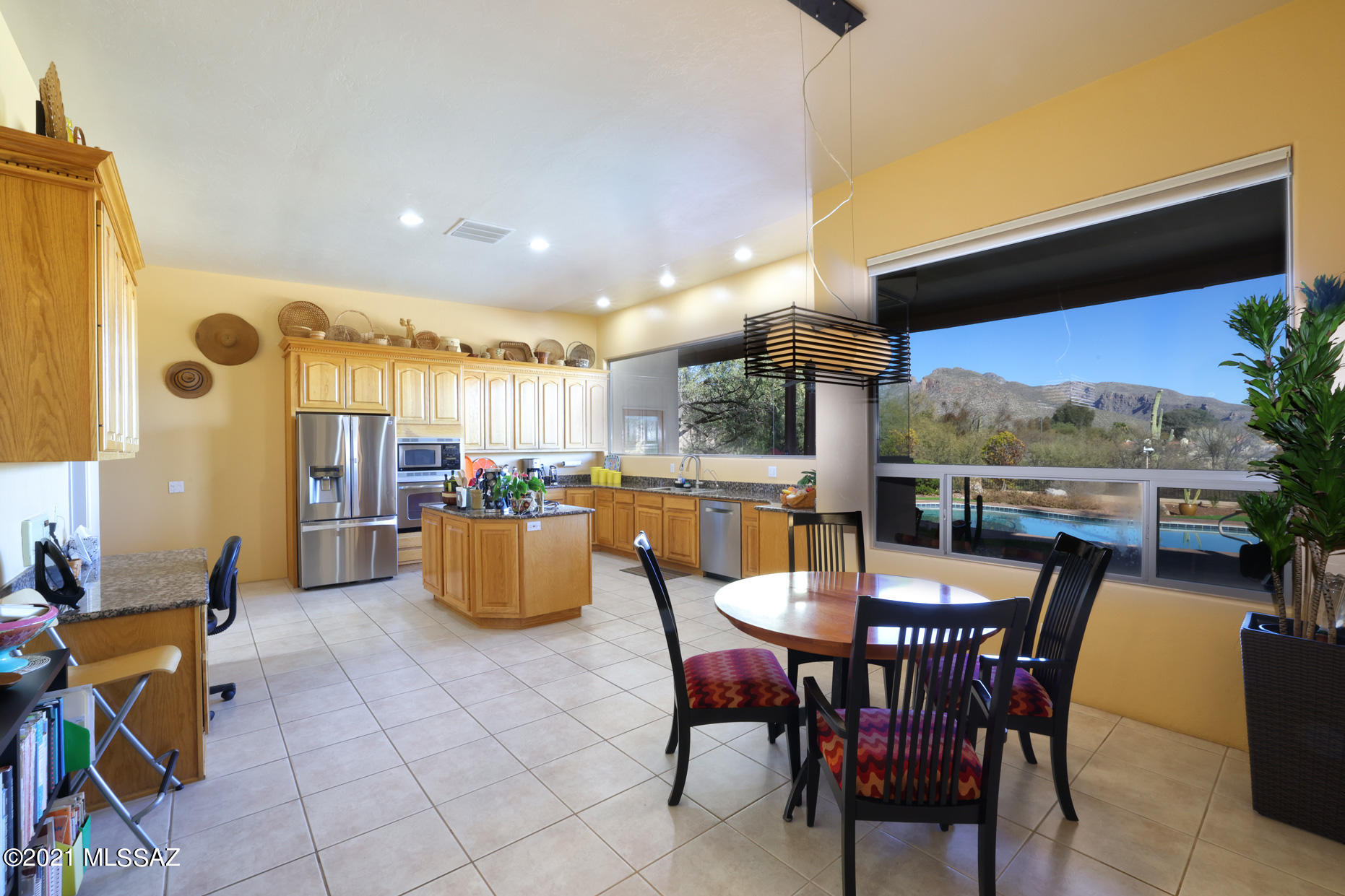 Beautifully designed and meticulously maintained custom foothills contemporary w/a touch of Santa Fe.
Coveted views of Sabino Canyon & the Catalinas from interior windows and from private  backyard. Thoughtful floorplan with large bedrooms & abundant storage. Sophisticated living room w/wet bar & gas fire place. Formal dining room w/private patio. Upscale kitchen designed for cooking, enjoying conversation & watching the beautiful mountain views through seamless glass windows. Center island, granite counters, SS appliances, walk in pantry, travertine floors. Comfortable family room off kitchen with gas fireplace. Built ins and French door to back patio. LARGE brs, walk in closets. Private split master suite w/gas fireplace, luxurious bath and more incredible windows. 
Beautiful pool & sp spa, lots of trees and privacy. Truly a resort style yard.  Walking distance to Sabino Canyon for the best hiking and bird watching.