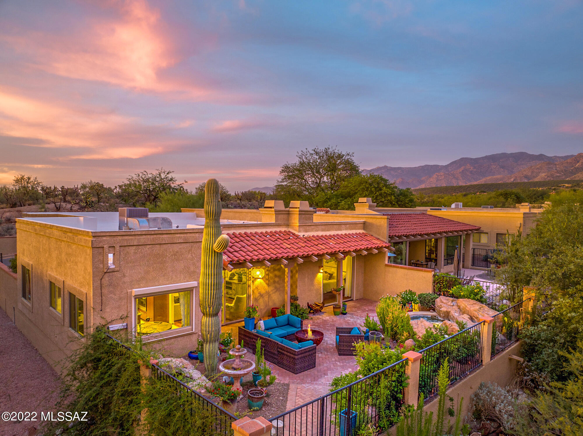 Luxury resort style living in this spectacular patio home situated on the golf course at El Conquistador. Enjoy panoramic sunset & mountain views from the private, serene back yard w/ a luxurious heated, built-in spa w/ waterfall, lush landscaping, & water fountain.  This meticulously manintained 2 bedroom, 2 bathroom +den, 1868 sq ft. home has been renovated throughout. Fantastic gourmet kitchen w/ quartz counter tops, stainless steel applinaces & custom cabinetry. The master bedroom ensuite has a fireplace & sliding glass door w/ access to the back patio & spa. Incredibly spacious second bedroom & den which would be ideal for a home office. Updates include new pella windows w/ security shutters, newer HVAC & water heater, new lighting fxtures, landscape lighting & much more!