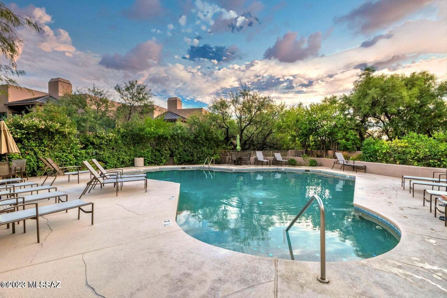 Charming 2BD/2BA Catalina Foothills condo with full mountain and city views!  Views from every room! Located within the resort-like community of Canyon View at Ventana Condominiums.  Updated kitchen with granite counter-tops, dining area, fresh light and bright colors.  Laminate flooring throughout (no carpet)!  Split floor plan, fireplace and large outdoor patio area.  Washer/dryer included.  Community offers 2 heated swimming pools, spa, tennis court, fitness center and access to the Ventana Trail Head.