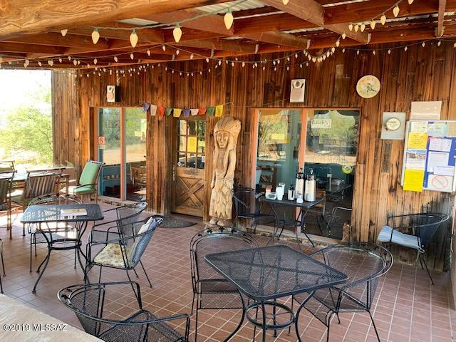 Talk about a opportunity and Priced to sell.  This was formerly the Gadsden Coffee Company.  This property has 3 buildings with the Business all with one Price.  The coffee shop has all the necessities to start up again and be a thriving business in Arivaca !!  The home needs lots of TLC , but talk about a view to the west Mountains and solitude.  This even has a 968 sq. foot Casita  with a 560 Sq. foot 2 car garage. The Coffee shop has approximately 928 sq. foot.   There is also a 160 sq. foot shop  that can be used for meetings.  There are endless possibilities here for a Business location with your home just a few steps down the hill, yet have all the privacy you would need. Also included in this is the 2.48 acres that has a cell tower on it.  This generates $850.00 monthly income.