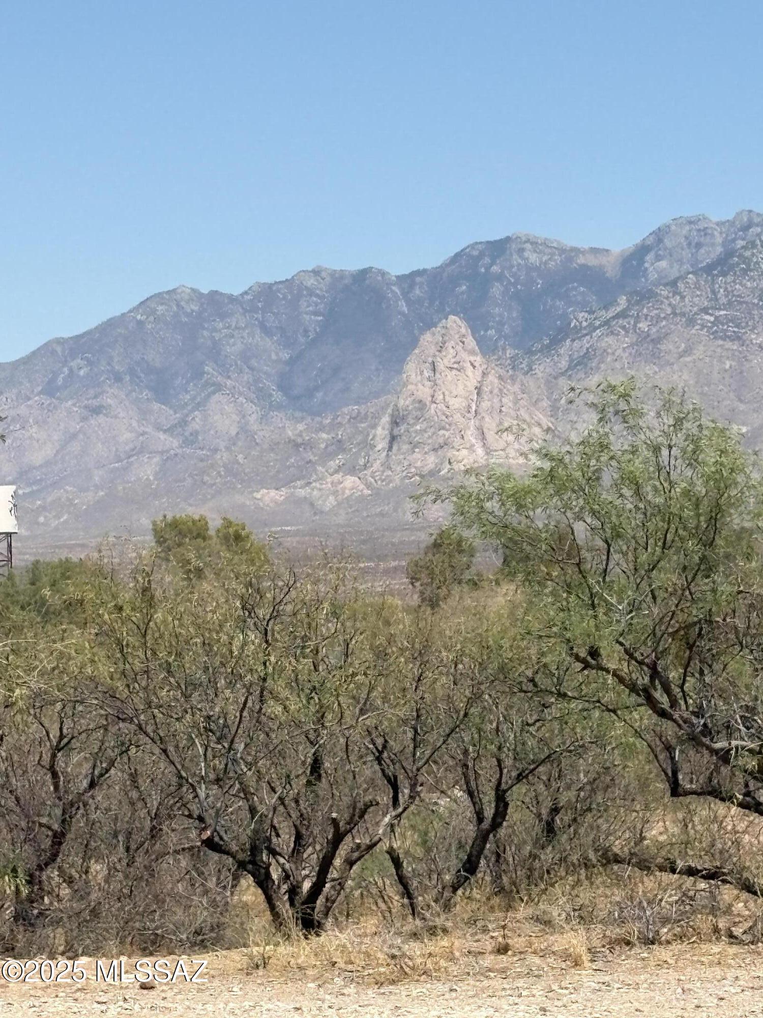 Enjoy great mountain views on this one acre plus lot. This site has many trees and several possibilities for you to place your home. It's just 1/2 mile from I-19 in Amado. (The land owner may consider carrying a partial note with credit approval.)