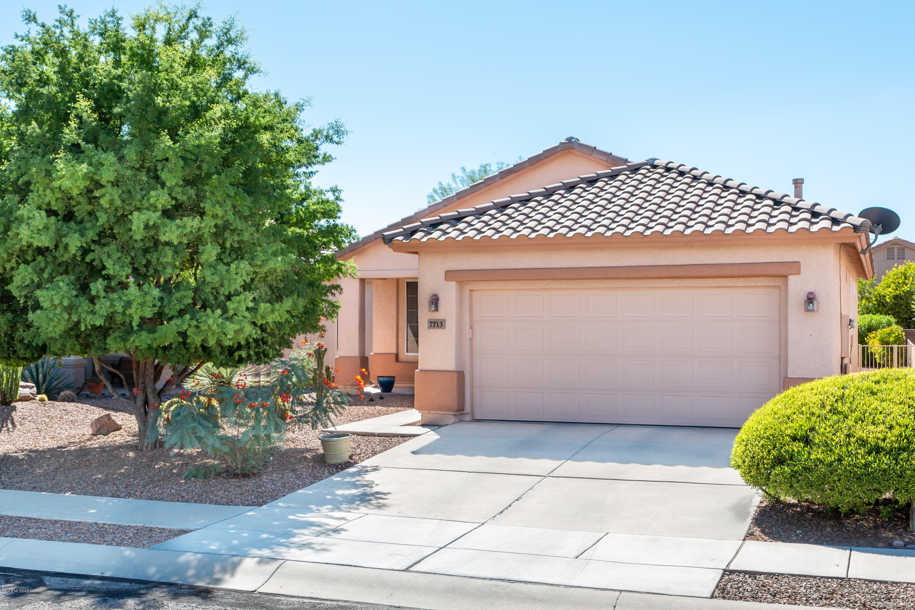 This beautiful, efficient Sunrise model home, complete with private entry patio is move-in ready. Upon entering the living space you will notice an abundance of natural light filtering throughout this cozy floor plan. The kitchen is open to the dining area and comfortable living space. Located at the rear of the home, the master suite has a bay window with views of the back garden area. The master en-suite includes tub, shower and walk-in closet. The guest bedroom and guest bath are conveniently located. The laundry area is situated in the oversized 2-car garage. Additionally, a screened rear patio provides a lovely place to relax. An open space provides privacy from the rear neighbor. The backyard is gated and pet friendly. All appliances convey.