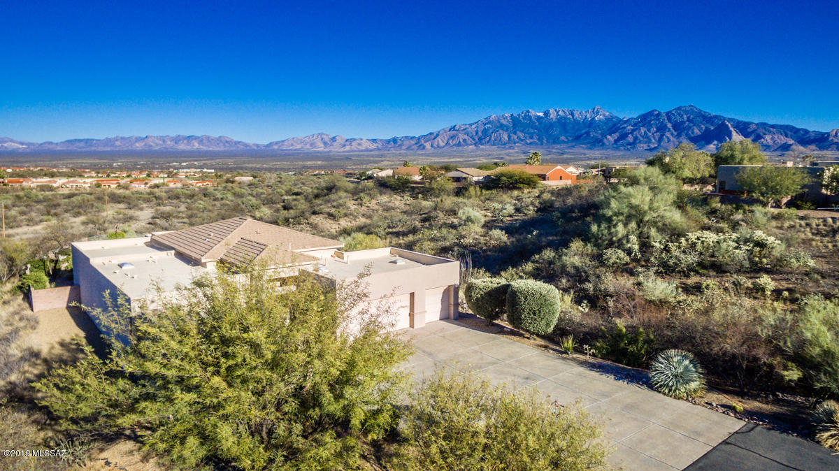 SPECTACULAR HOME! On 1.9 acres. Like having a private island in the desert! Private with panoramic views! Like a custom home...there is also a casita w/bath, Pool, spa, lots of outdoor sitting areas and an extraordinary screened patio-super high ceiling work done by S&S Construction so it is like an outside living room.  Inside, 2 Bedrooms, den, 2.5 baths. Lovely paint colors throughout  and  designer features EVERY WHERE! Even the laundry room is exceptional! An absolute MUST SEE!  Arizona living at it BEST!