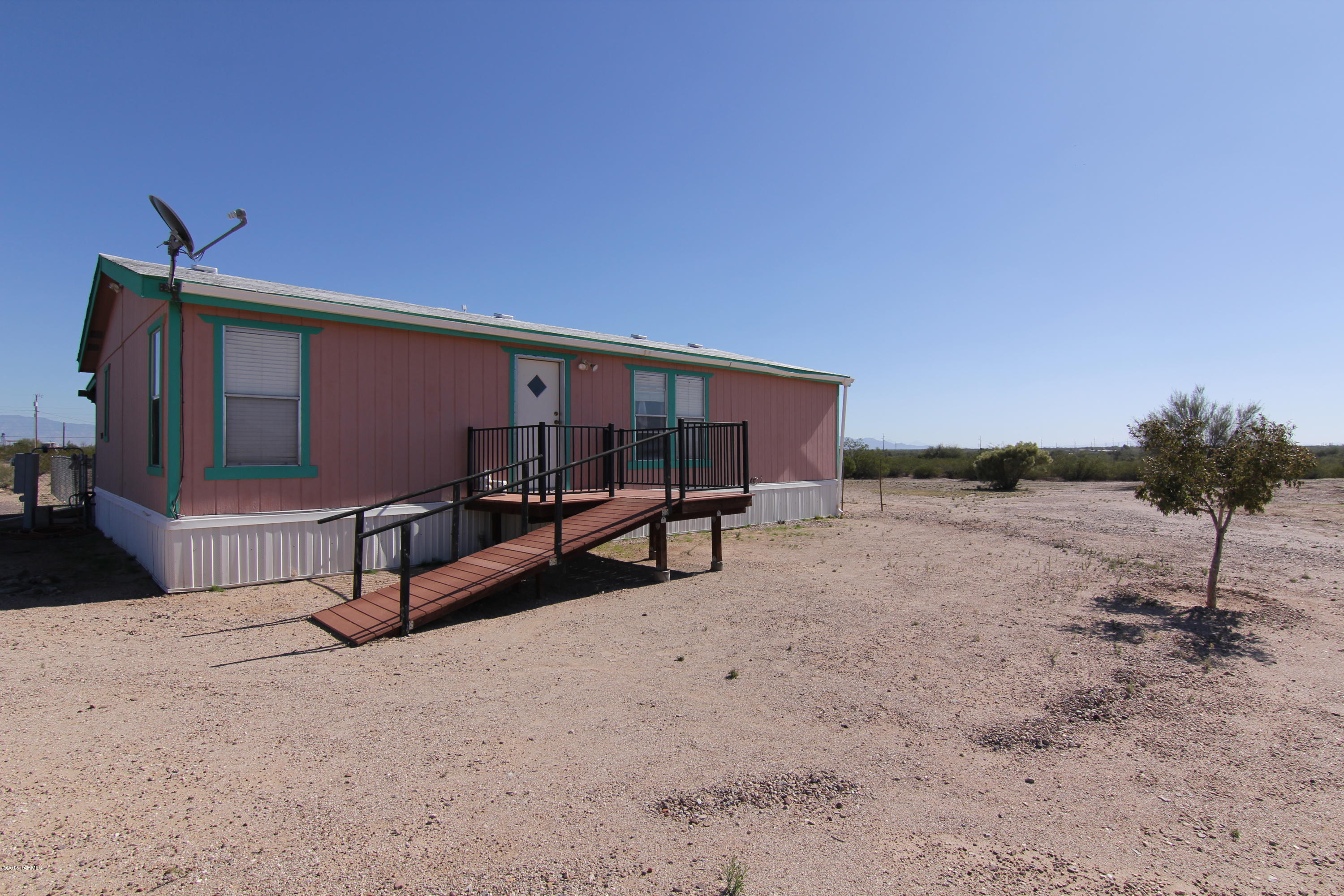 A wonderful home on over 4 acres of usable land. Topography is flat and cleared nicely. Bring the horses or toys. RV parking with hookups of water, sewer and 110. Split bedroom plan gives you privacy! Recently painted interior, flooring was installed in 2014. All appliances included along with many personal property items included as well. 16'x16' foot shop in a slab. Need a tack room? This would work great! Fenced area for the kids or pets, covered patio and great mountain views. Plus Sunsets!