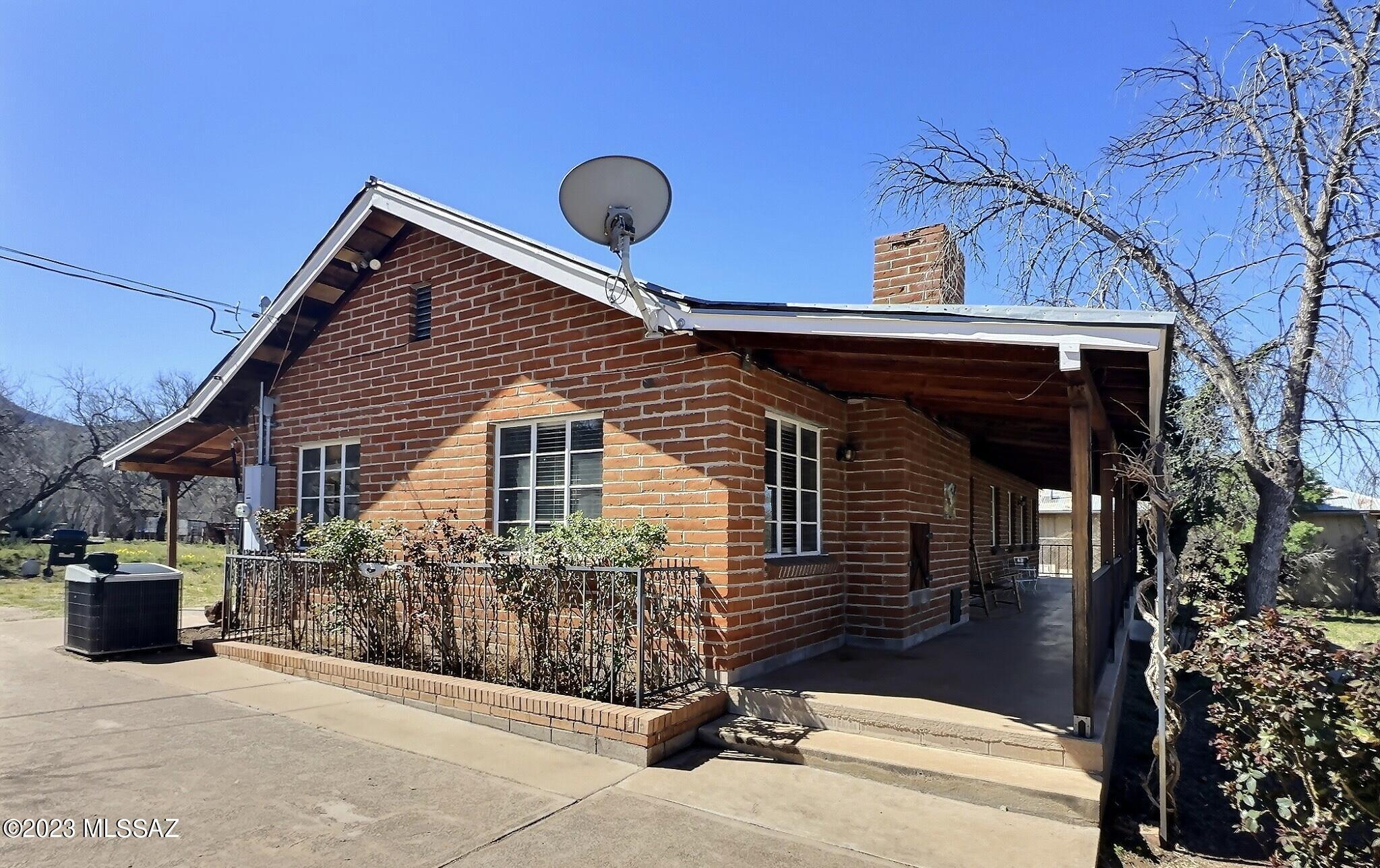 This is a charming single-family home in the heart of Patagonia, Arizona. This beautiful property has 2 bedrooms and 2 bathrooms, providing comfortable living space for families or couples. The exterior of the home is impressive, with a large backyard that is perfect for outdoor entertaining or simply enjoying the beautiful Arizona weather. Featuring a historic mining building that provided shelter for miners in the early 1900's. The home is situated in a quiet and peaceful neighborhood, surrounded by stunning views of the surrounding mountains and natural beauty. With its convenient location, this property provides access to local amenities, including shops, restaurants, and parks. Its a perfect home for anyone looking for a peaceful and comfortable lifestyle in the heart of Patagonia, Az
