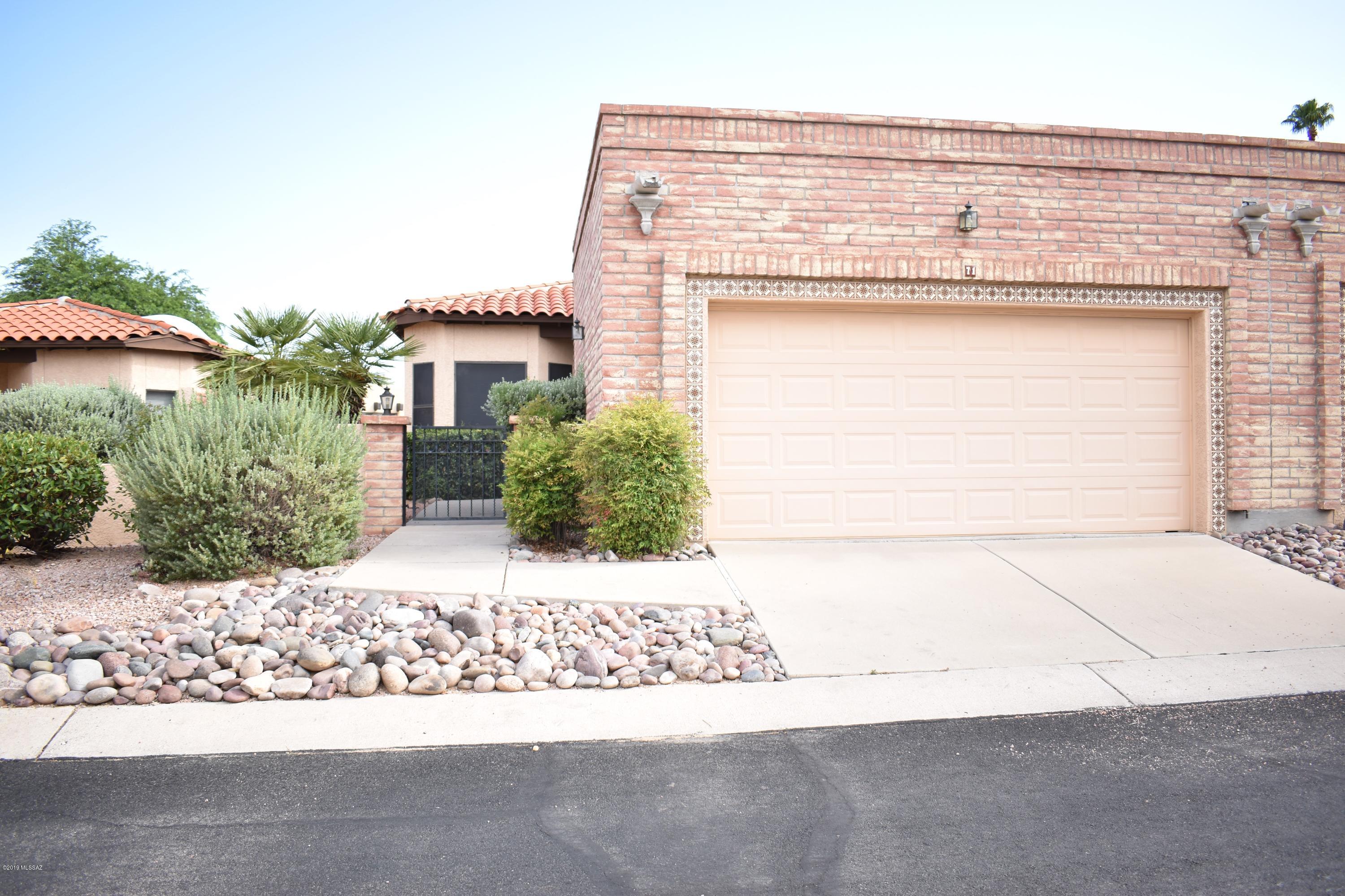 RARE FIND!! Terrific Valle Del Oro Townhome!   Charming courtyard entrance!  Gorgeous ceramic tile throughout!  Stunning kitchen boasts custom back splash, huge pantry closet, gorgeous white cabinetry and granite counter tops, stainless steel appliances  and a picturesque breakfast nook!  Spacious living room!  Lots of windows throughout the home to enjoy bright sunny days!  Master Bath has a walk-in shower & dual sinks!   Master bedroom has a patio door out to the inviting backyard.   The low care backyard has a huge covered patio to enjoy Tucson's refreshing monsoon season, fabulous fall evening, mild winters, and our amazing spring season!   Community has huge pool and spa!