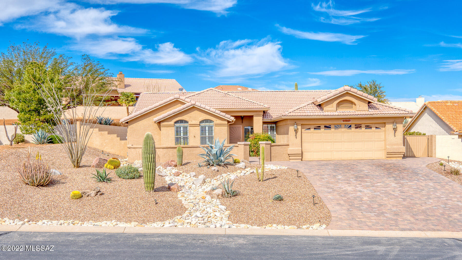 Welcoming entry patio is the ideal spot to enjoy mountain views from this two bedroom and den TOPAZ model. Upgraded and move-in ready.