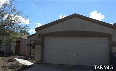 Light and bright makes this home inviting and oh so convenient to shopping, DMAFB and more. Open floor plan, covered patio and easy maintenance make this home agreat choice for your next home. Ceramic tile and lots of kitchen cabinets, eat in kitchen and more!Small subdivision with no through streets, 2 car garage.  Lots NEW tile throughout home.  3 bedroom and 1 and 3/4 bath makes this home one to see!
Master bedroom is lovely with large window and nice bath and HUGE walk in closet.