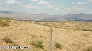 Fantastic views to the South and West. Gentle downhill slope. Over an acre, roads are paved. Water and electric at the street.