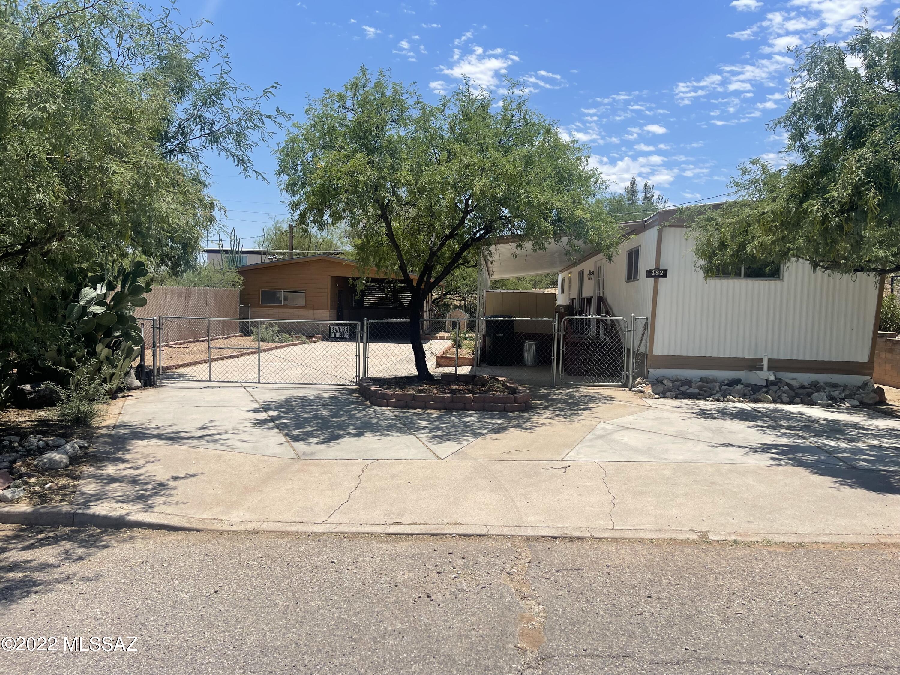 This property has so much to offer!  It might be small but it's very mighty!  This 2 bed 2 bath 720sqft mobile home is in great condition and would make a terrific place for a winter home or small rental.  It includes newer carpet, newer touches in the kitchen, moveable kitchen island, built in dresser in second bedroom, storage in the metal shed and workshop, concrete driveway that could be used for RV parking and newer AC unit.  Other features include, split floor plan, double doors to the covered deck, fenced yard,  laundry hookups, wood stove in workshop, one covered parking space and more!  Priced to sell and waiting for you!  Call today to schedule a showing!