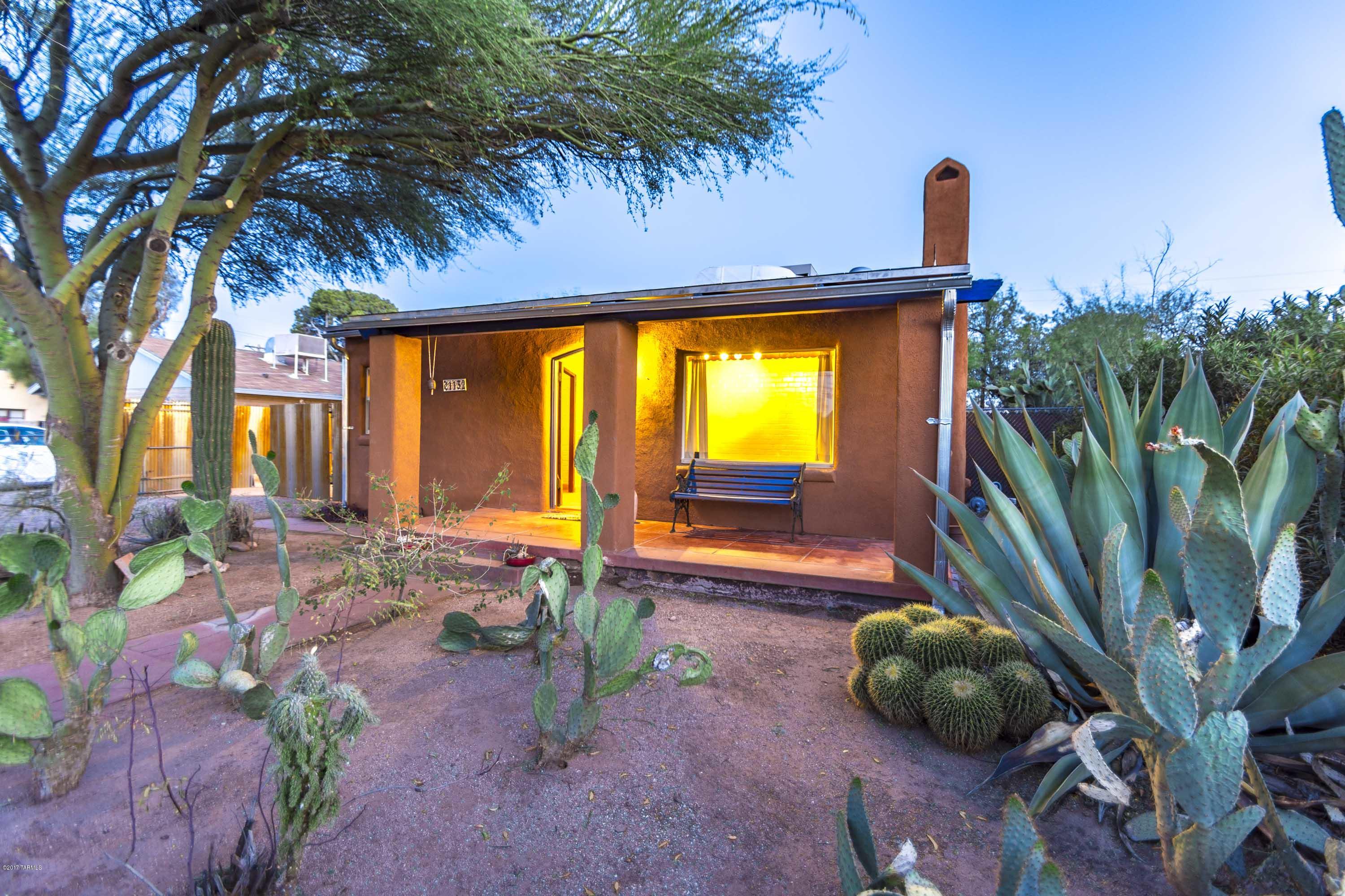 OPEN HOUSE 06/04/2017 2:00 PM to 5:00PM
Lovely University of Arizona area bungalo with gorgeous beam ceilings, wood doors and arched doorways. There is an extra room with its own entrance perfect for a home office or den. This beautifully maintained home has double pane energy efficient windows, central air conditioning a huge covered patio and a wonderful outdoor living area. The large fenced yard includes irrigation, rainwater harvesting, and a greywater system that is perfect for the gardener with a large outbuilding that matches the home and is perfect for storage or a workshop. Tile floors throughout and wonderful accents and details. Located so close from the Mountain Avenue bike path!