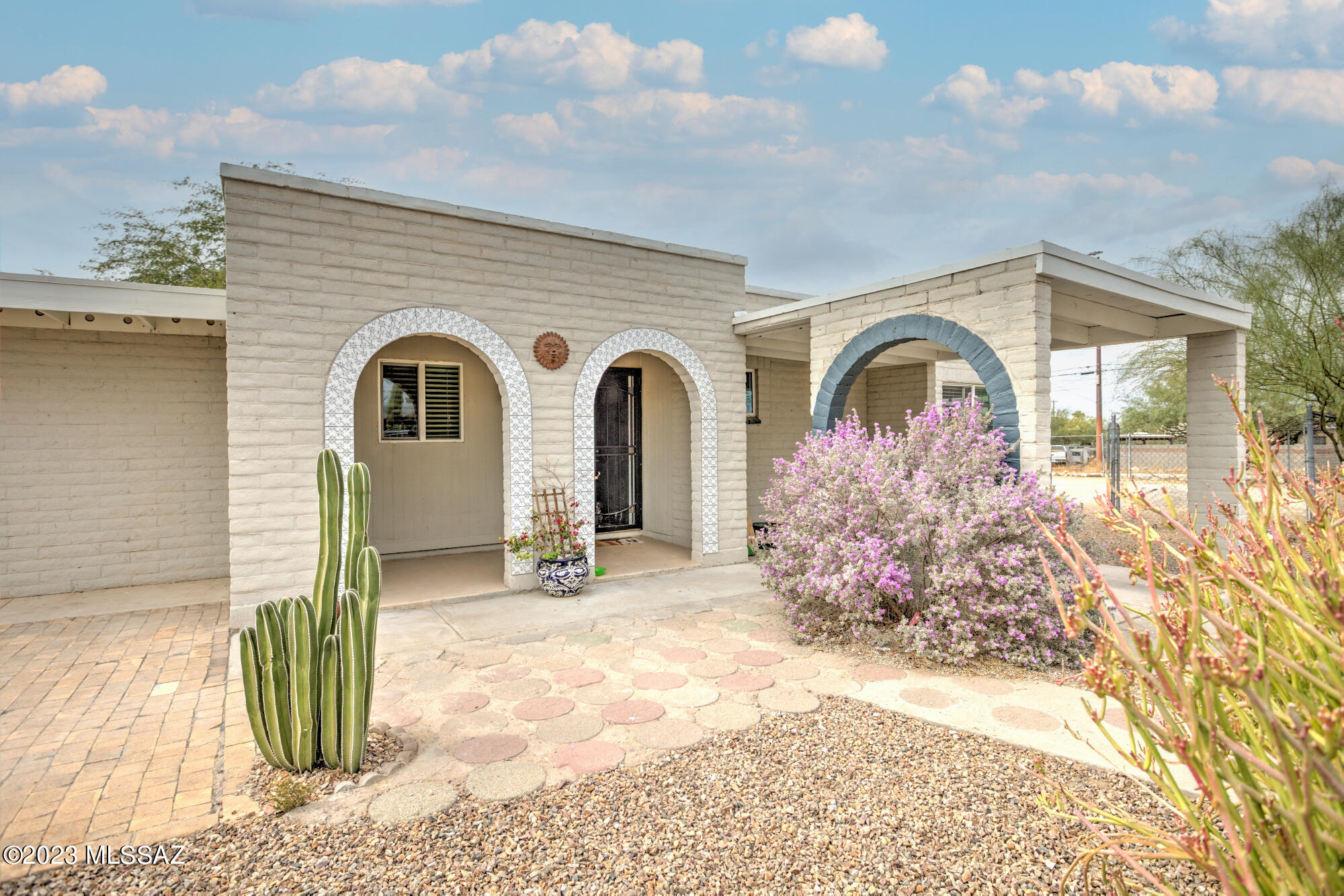 Welcome! This 5 bedroom + den (or office), 3 bath, 1827 sqft gorgeous home sits on a huge 0.17 acre lot!  The interior is newly remodeled with tile floor, granite tile counters, stainless steel appliances and modern tile backsplashes. The outdoors are completely inviting, the south patio comes with a gazebo, you'll love it. This property sits on an R2 lot. With R2 zoning, you have the opportunity to build a duplex, allowing for potential rental income or the option to live in one unit and rent out the other.  Furthermore, both sewer connections are brand new (a value of $48k+ to the new owner!)  Don't miss out on this fantastic opportunity to own this R2 lot in Tucson