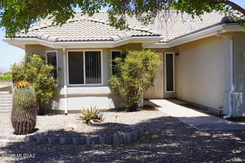 Light and Bright home in town Sunsites with a nice split bedroom floor plan, great room and an extra large Arizona Room facing East. Back yard faces the vineyard! 2.5 car garage has one door for vehicles plus a smaller door in back for golf cart or side by side. Kitchen has breakfast bar plus dining area. Double pantry closets. Lots of light coming in with transom windows up high. Vaulted ceilings. Neutral paint throughout. Master bedroom has office and large master bath. Arizona room has built in outdoor kitchen. Sliders off the living room plus the master bedroom. Tile roof. Low maintenance decorative gravel yard, with large shade trees. Concrete driveway. Vacant lot on either side of the home. Central AC.