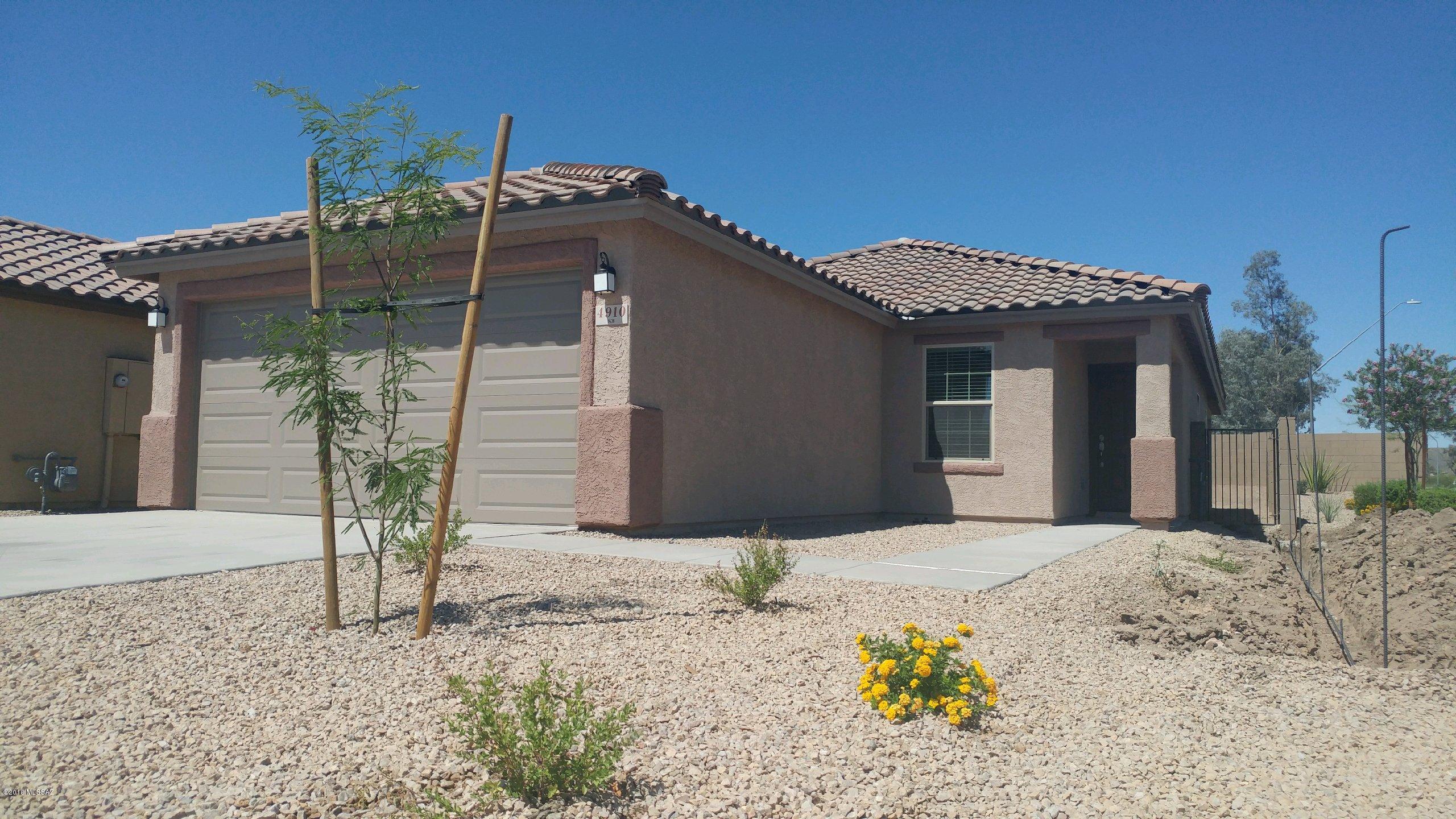 Brand New KB Home in the middle of the City. Close to I-19 & the Tucson Spectrum shopping center. Within 15 minutes of Raytheon, UA, and UMC. Beautiful 3 Bedroom 2 Bath home with Corner lot with easy access. Home features include stainless steel appliances, quartz solid surface countertops, painted white cabinets and tile through out besides the bedrooms. Highly Energy Efficient New Home will save you much on your utility bills. If You
Want NEW But Don't Want To Wait!! 

Price includes a reduction of $10,600 that is contingent on buyer obtaining financing through seller's preferred lender, KBHS Home Loans, or paying cash.