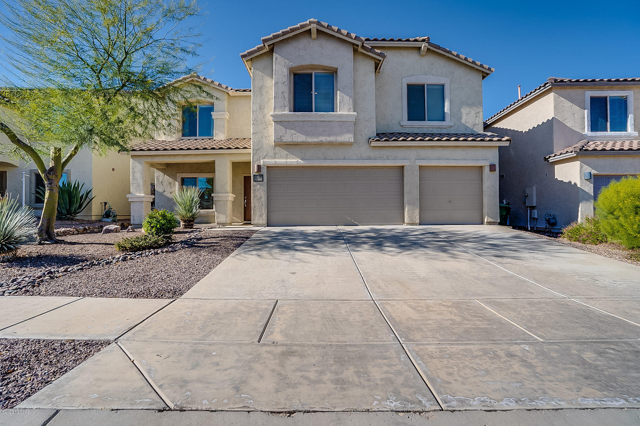 Get ready to fall in love! Tucked away in the award winning community of Rancho Sahuarita, this beautiful home boasts a spacious 5 bedroom floor plan, upgrades galore, and a gorgeous backyard for entertaining. You will enter into a bright living & dining space that flows to a great room and upgraded kitchen including custom finished island, SS appliances and custom lighting. Down the hall you'll find a home office with built-ins. A loft/game room is located at the top of the stairs. All 5 bedrms are upstairs. The huge master retreat boasts of a massive walk-in closet and a gigantic CUSTOM shower. Two bedrooms are connected with a jack-and-jill bathroom.  The backyard is an absolute delight with green grass, hot tub under a separate ramada, view fencing, & extended covered patio. NO CARPET!