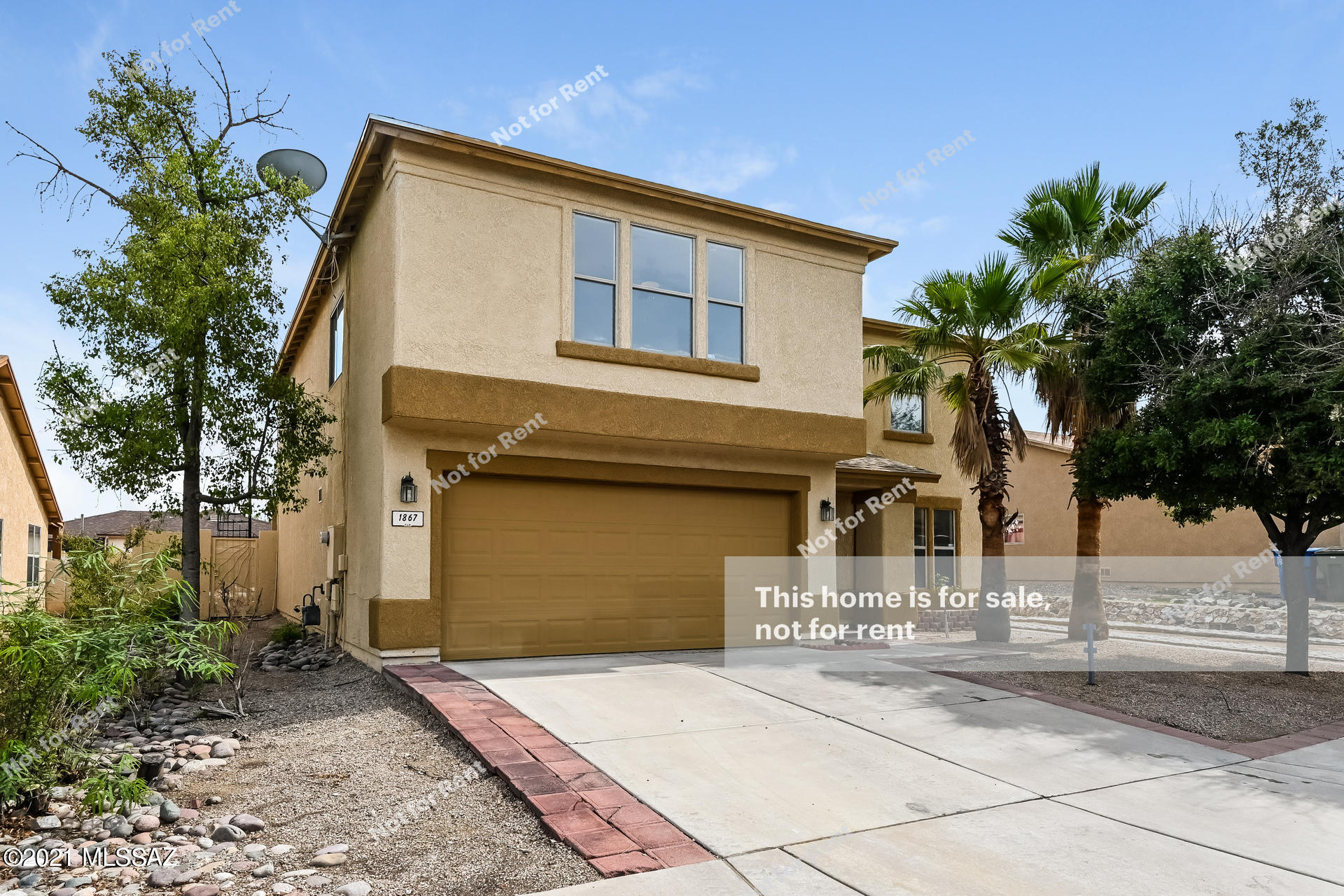 This Tucson one-story home offers an in-ground pool, a patio, and a two-car garage.