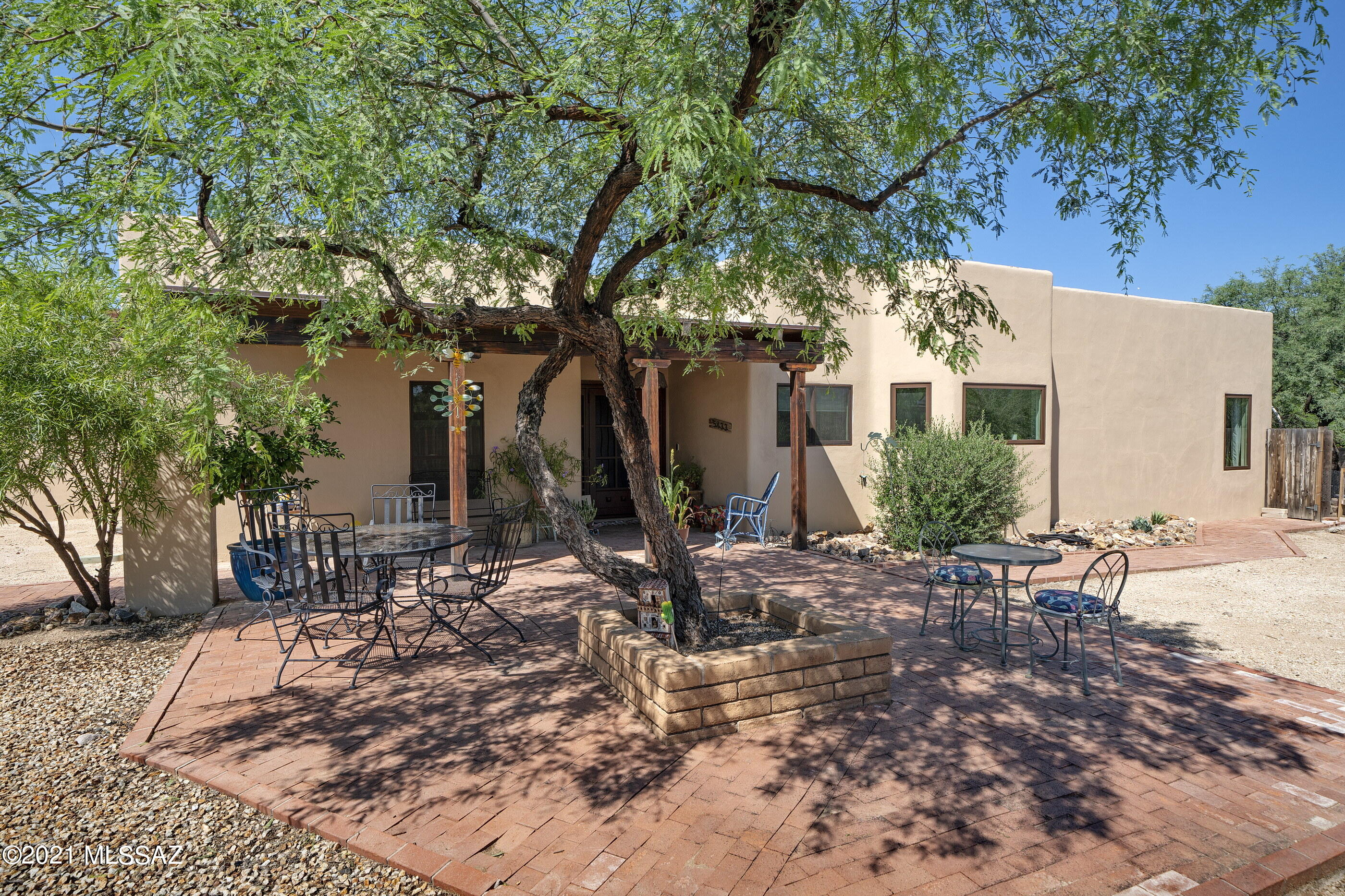 Located in the historic Old Fort Lowell neighborhood, this custom built 3 bed/2.5 bath home exudes southwestern charm w/ tasteful modern updates throughout. Situated on a quiet 1/2 acre lot behind a large vacant parcel & away from Fort Lowell. Enjoy stunning mountain views from your picturesque kitchen window & backyard area complete w/ remodeled pool/spa, pavers & turf. Cozy living room has fully functional mid-century modern wood burning fireplace, perfect for the cooler Tucson nights. Split floor plan w/ large master suite featuring double vanities, tub, walk-in shower & 2 closets. Quality touches & updates throughout including Anderson windows, knotty alder doors, remodeled bathrooms, metal garage door, custom gate around pool, custom entry door, newer roof & A/C's. Move right in!