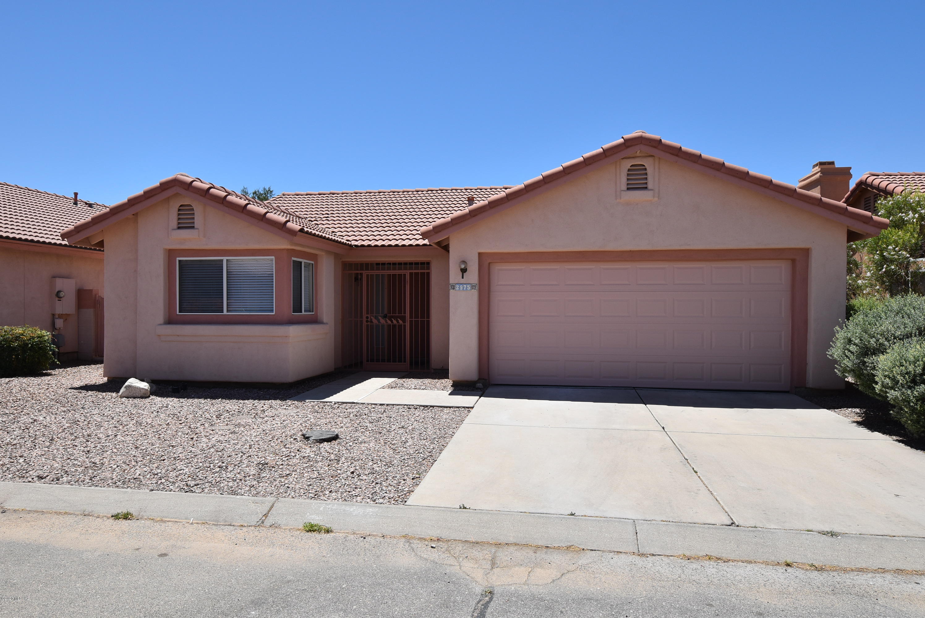 All tiled in North Ranch neighborhood with 2 community pools, spa, tennis courts & other amenities. Charming 3BR/2BA with lots of upgrades including tile flooring throughout (no carpet!). Kitchen & both bathrooms have granite counters with updated sinks & lighting. Light & bright kitchen with SS appliances & breakfast bar that opens to the great room. Primary bedroom features walk-in closet, double sinks in the bathroom, tile surround in the shower, & glass sliding door to the patio. Ceiling fans in all the bedrooms & living room. Vaulted ceilings, 2 car garage with storage cabinets, laundry rm with washer/dryer & covered patio off the living room. Easy care landscaping. Non-smoking home. 1 yr minimum lease required. $45 application fee per adult. Subject to back ground & credit checks.