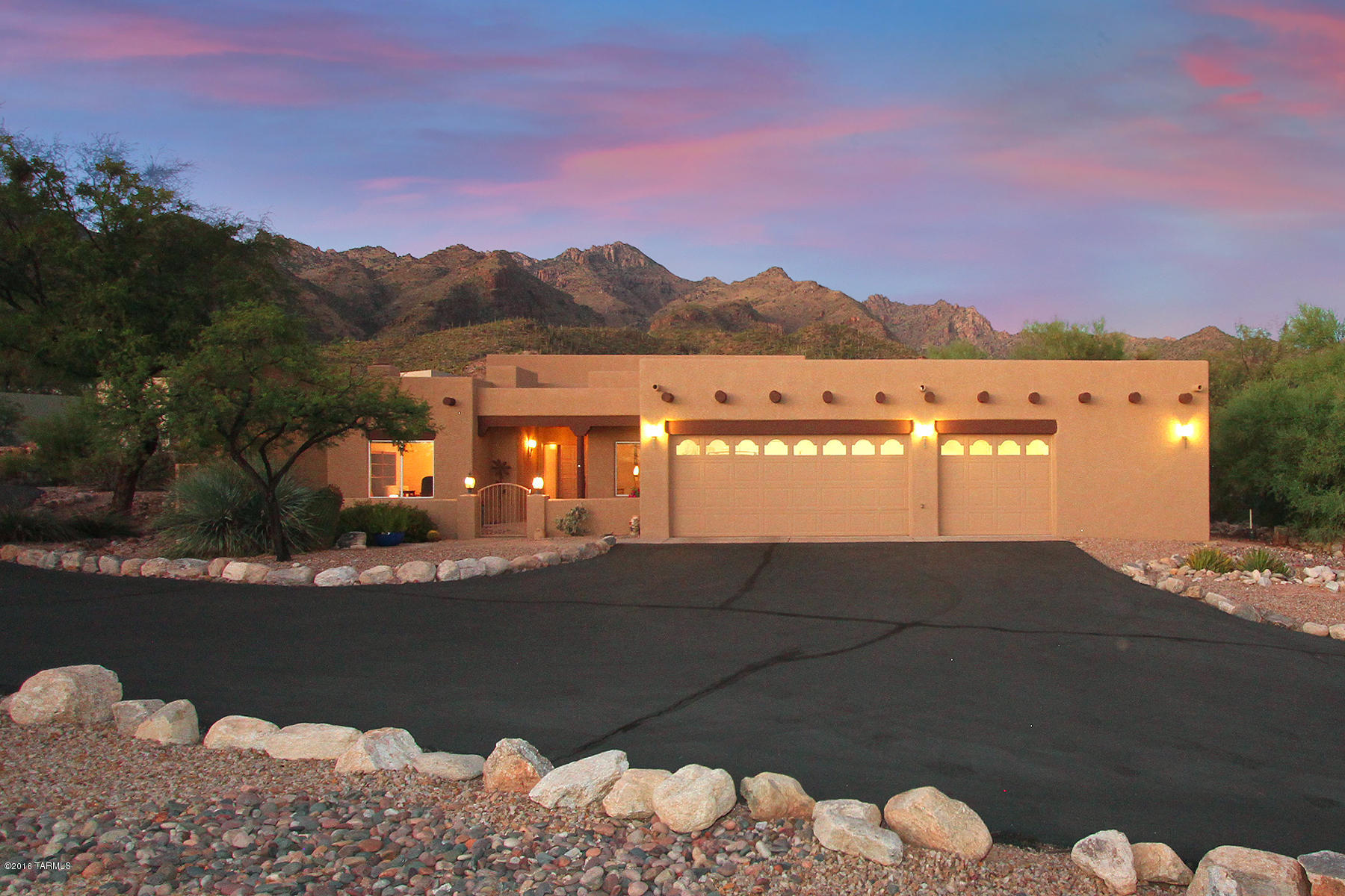 Fantastic location! Only 1 lot from Coronado National Forest and EZ walking distance to Sabino Canyon and District 16 schools. Absolutely charming, updated Sante Fe on a private acre lot offering stunning mountain views. Spacious open floorplan with soaring viga beamed ceilings and walls of windows. Gourmet island kitchen with beautiful cabinetry, tiled counter tops and quality appliances. Spacious family room with high viga beamed ceilings and cozy fireplace. Private master suite with dual fireplace. Luxurious bathrooms. Oversize garage with air conditioned workshop. Freshly painted exterior. Reconditioned roof w/ warranty. Outdoor living at its finest with 2 covered patios, large walled north facing rear yd and views. Cosmetic updating and rear landscaping needed but priced accordingly. See full size floor plan in virtual tour link (photo section).

Custom home built by Al LeCocq (2 time SAHBA Custom Home Builder of the Year).

Upper oven in kitchen and evap cooler in workshop in garage (still has AC) sold as-is.