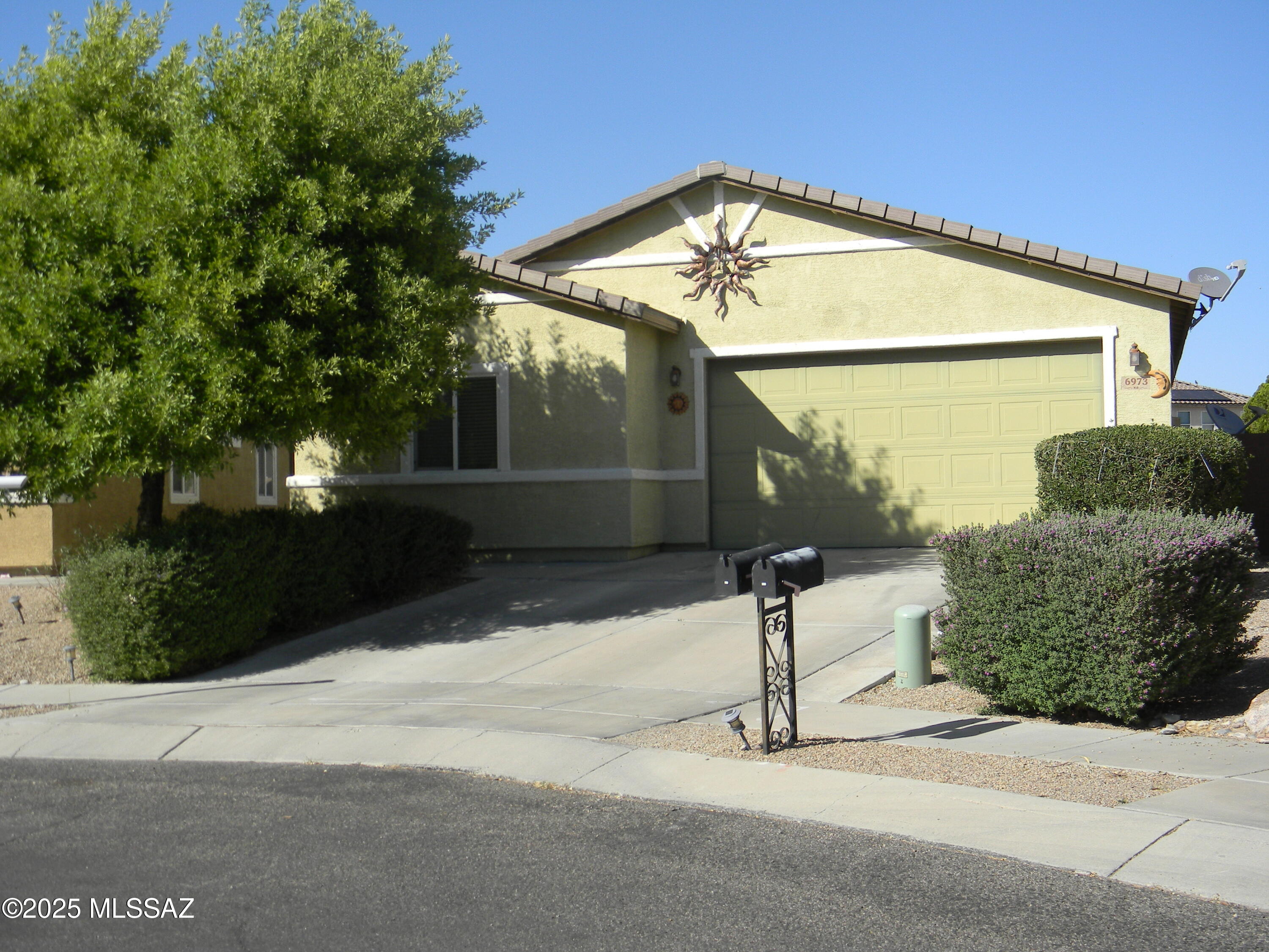 Beautiful and pride of ownership. 4br home all tile floors, Large Kitchen, open floor plan opens to large Arizona room with cooling and tile floors. almost a 1/3 acre of land plus many concrete side walks landscape with trees, cover Gazebo. green turf and planters. Ariz Room sq. ft not included with home sq. ft.