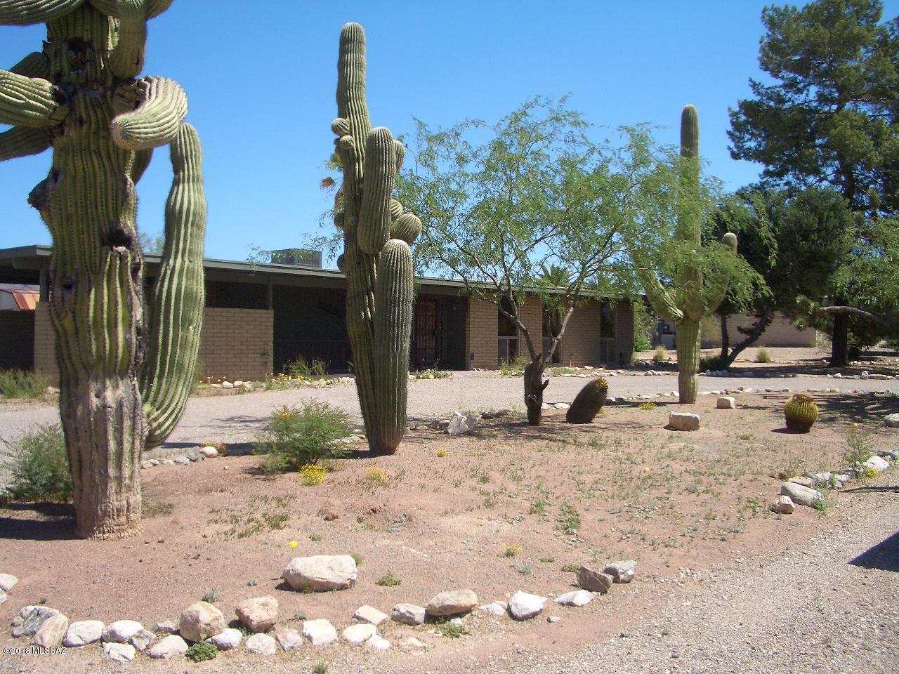 Quintessential Tucson slump block ranch home. Spacious with grand views of the Santa Catalina Mountains. Room for a pool, horses, you name it.