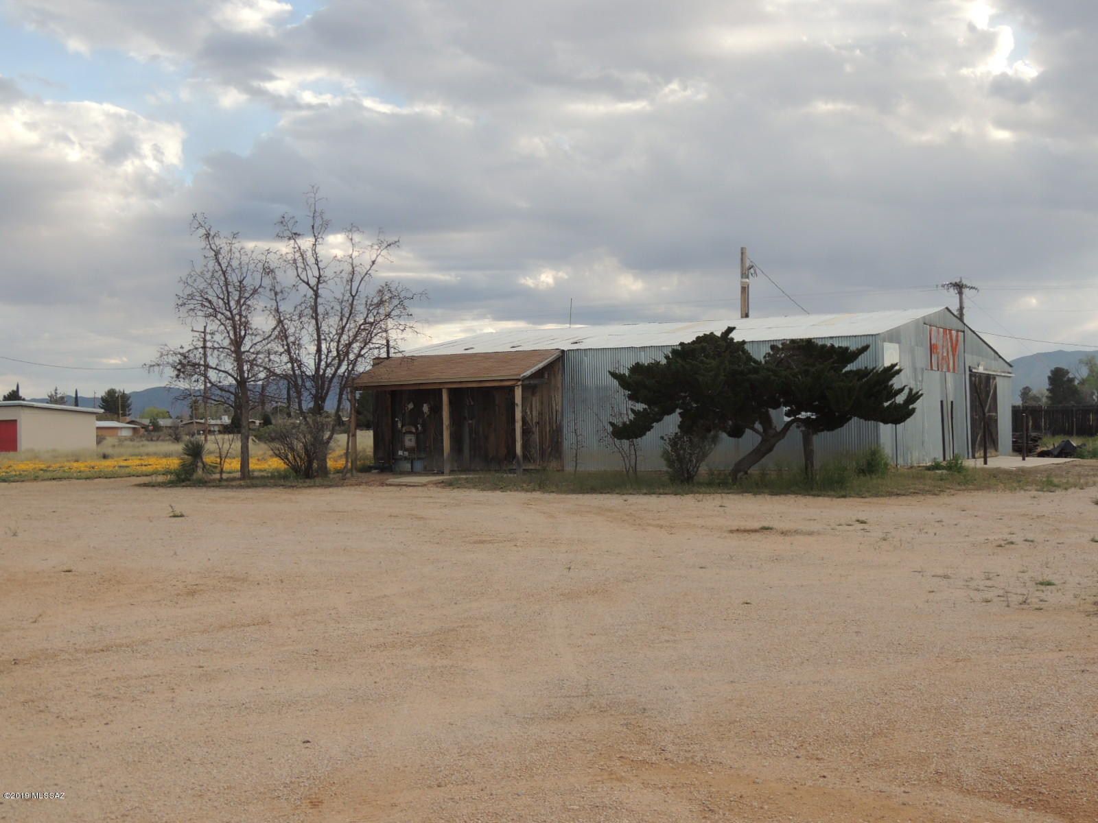Great business opportunity - great location!  This building has been a feed store, a mechanics shop and a beauty salon. Sale includes two lots and a large 2144 square foot building for a business or businesses. It only needs your imagination.  Don't let this pass you by.